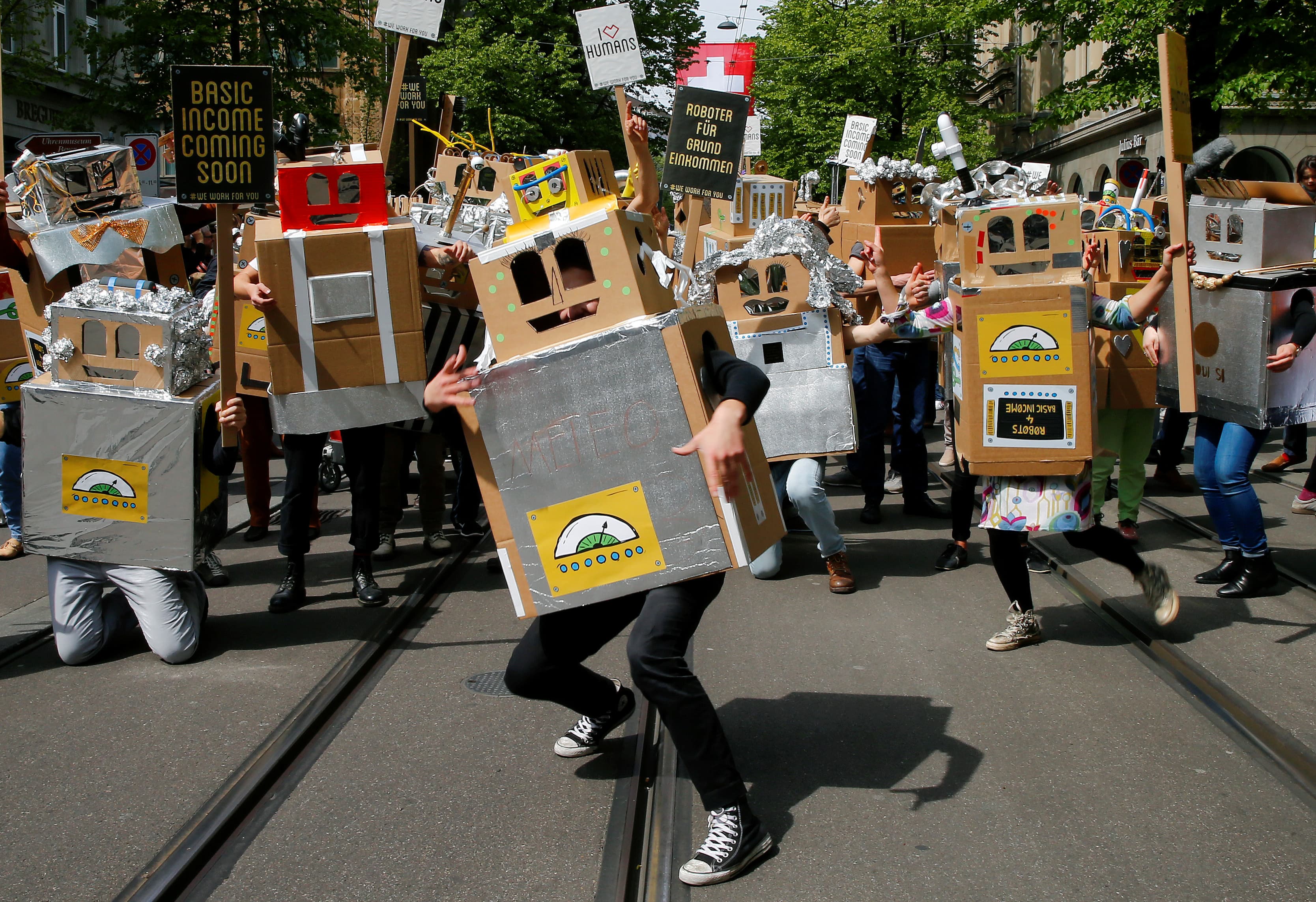 Protesters dressed as robots demand a basic income