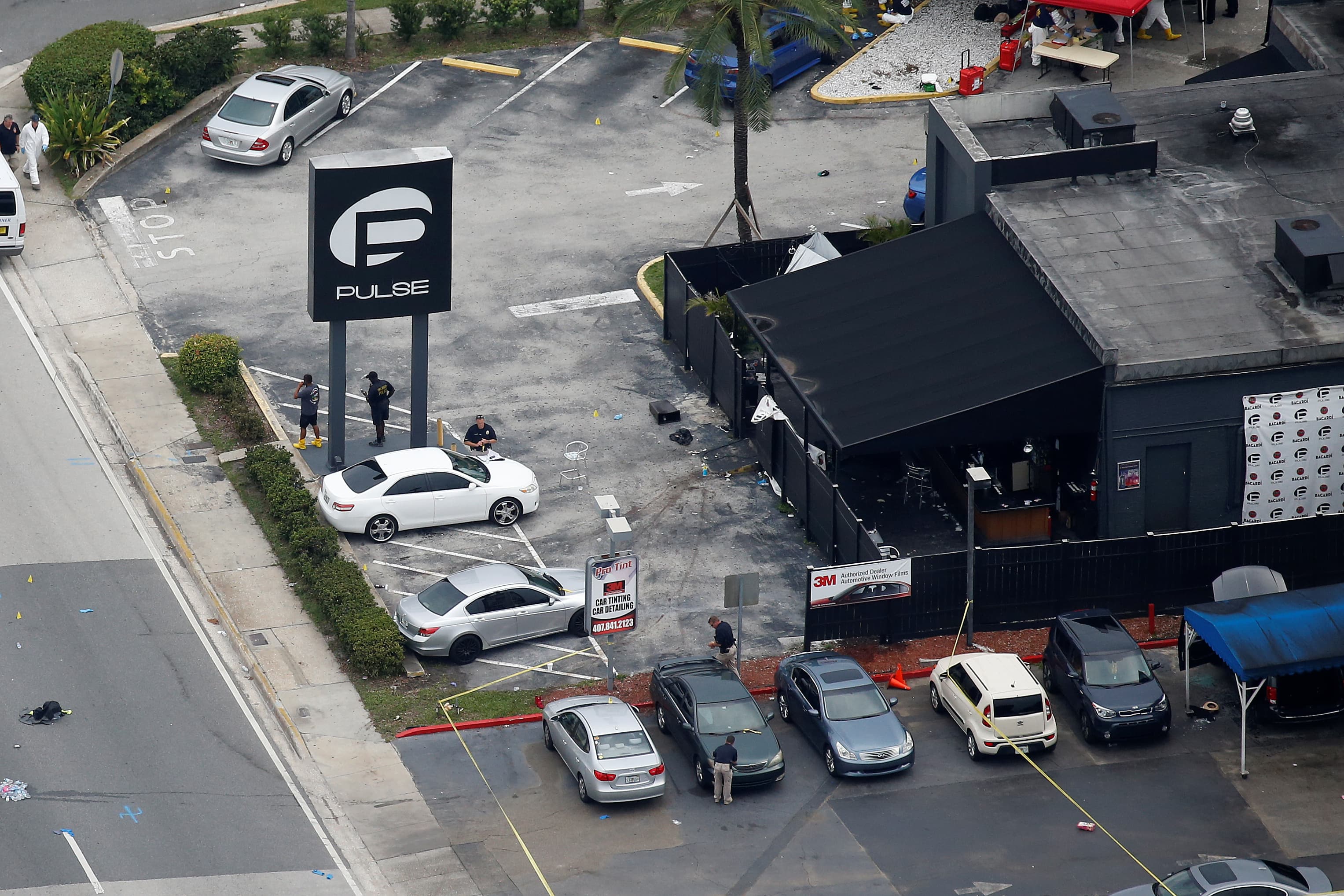 Investigators work the scene following a mass shooting at the Pulse gay nightclub in Orlando Florida, June 12, 2016.