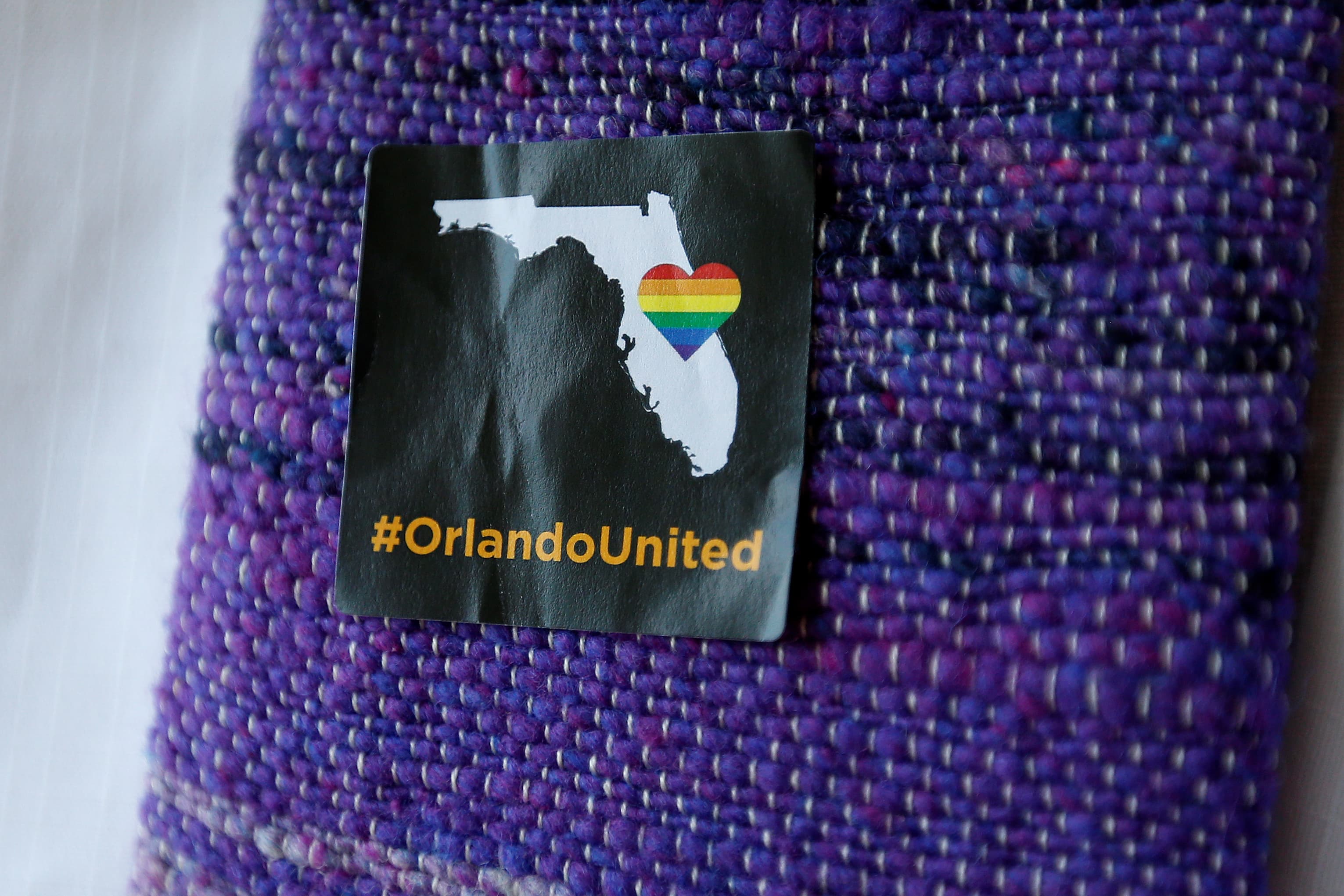 A #OrlandoUnited sticker is pictured on a clergyman's shawl before a prayer service at a memorial chapel in Orlando, Florida.