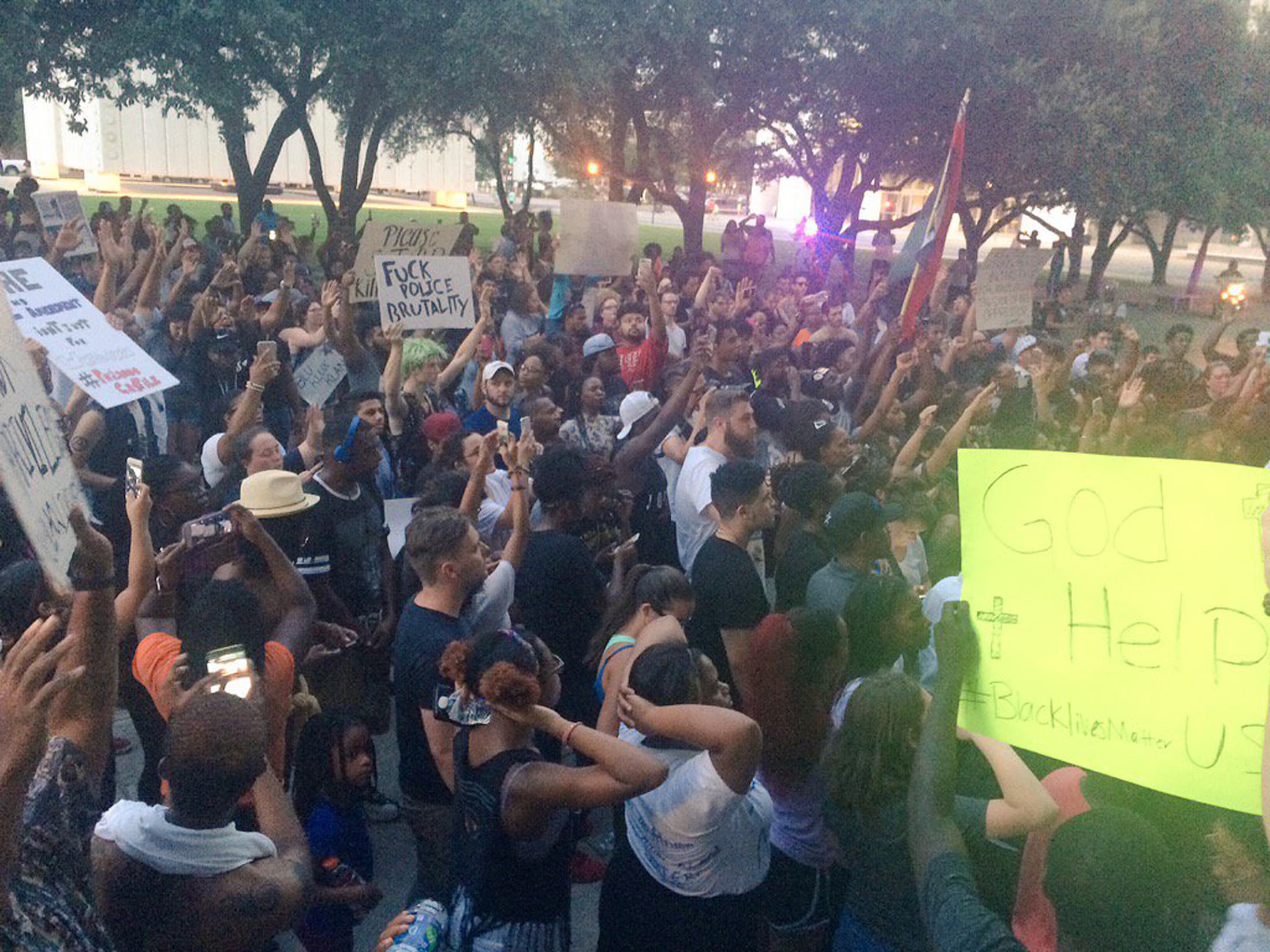 Marchers protested peacefully against police shootings of black men in Dallas, Texas, before a sniper opened fire on police and protesters.
