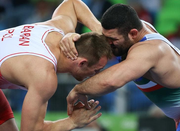 Wrestlers Radoslaw Baran (POL) of Poland and Reza Yazdani (IRI) of Iran compete in the ​2016 Rio Olympics, Rio de Janeiro, Brazil.
