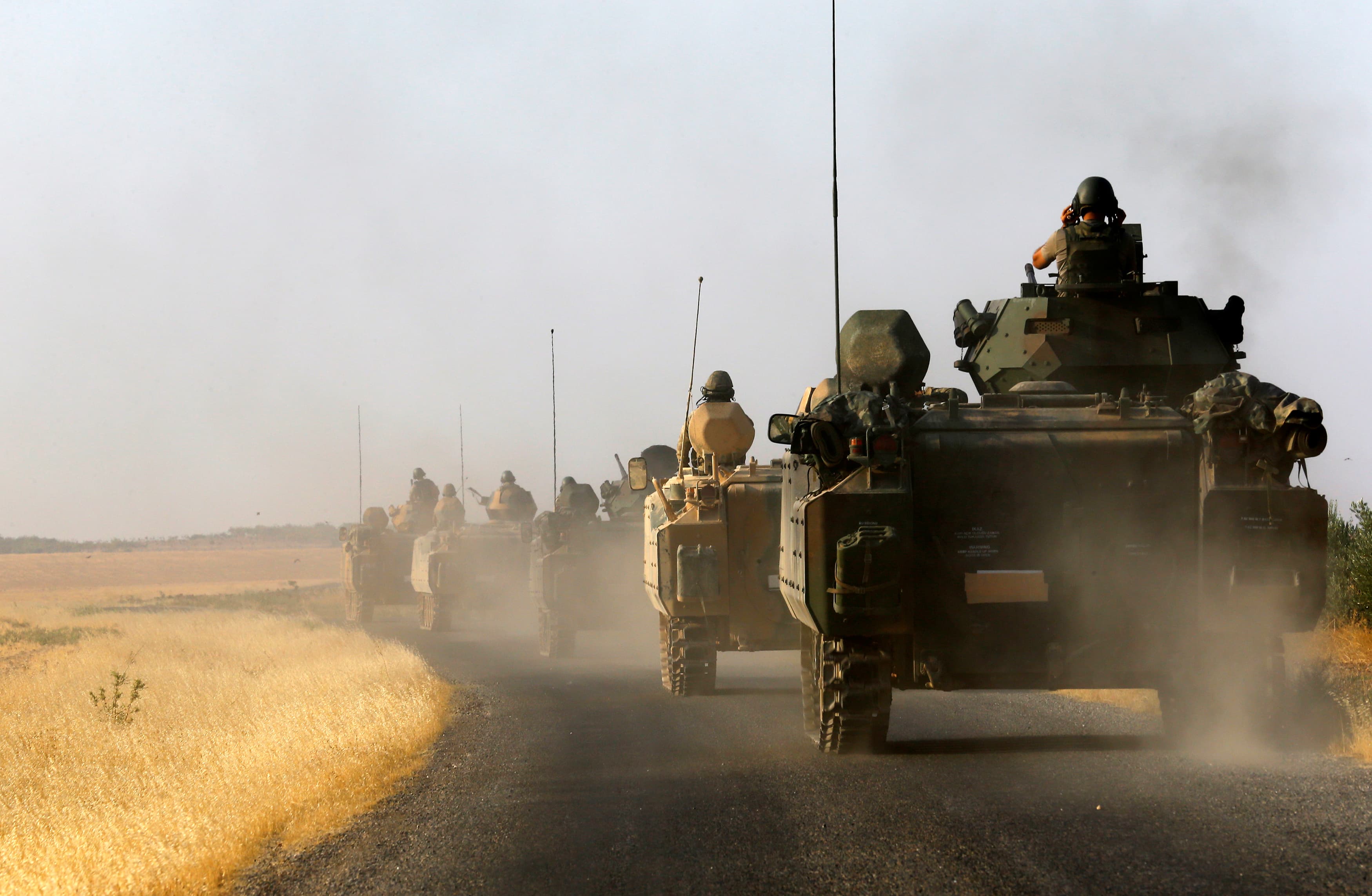 Turkish tanks driving toward Karkamis on the Turkish-Syrian border in the southeastern Gaziantep province, Turkey, on Aug. 27.