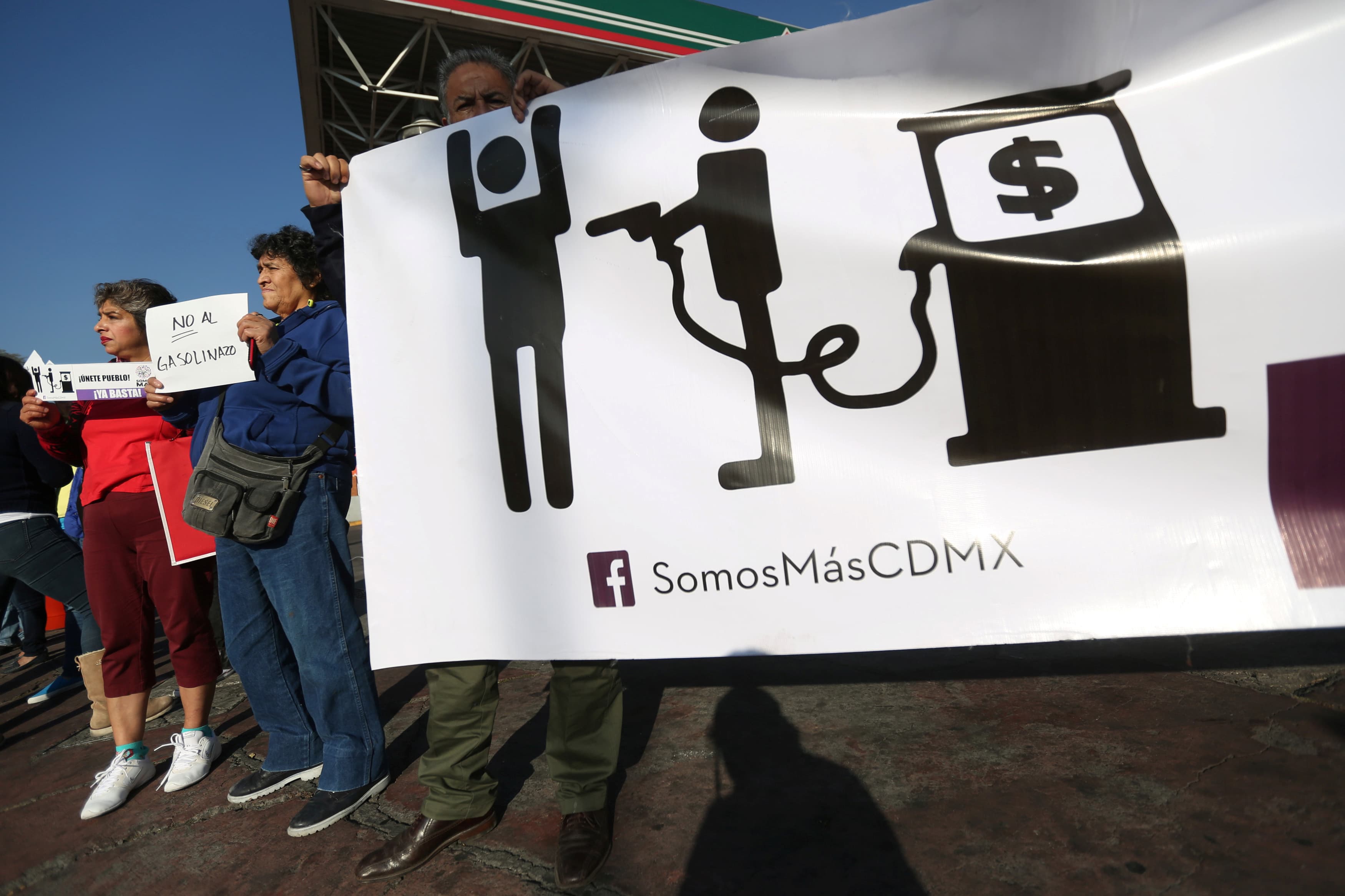 Protesters block the entrance to a gas station during a demonstration against rising gas prices at Tlalpan avenue in Mexico City, this week.