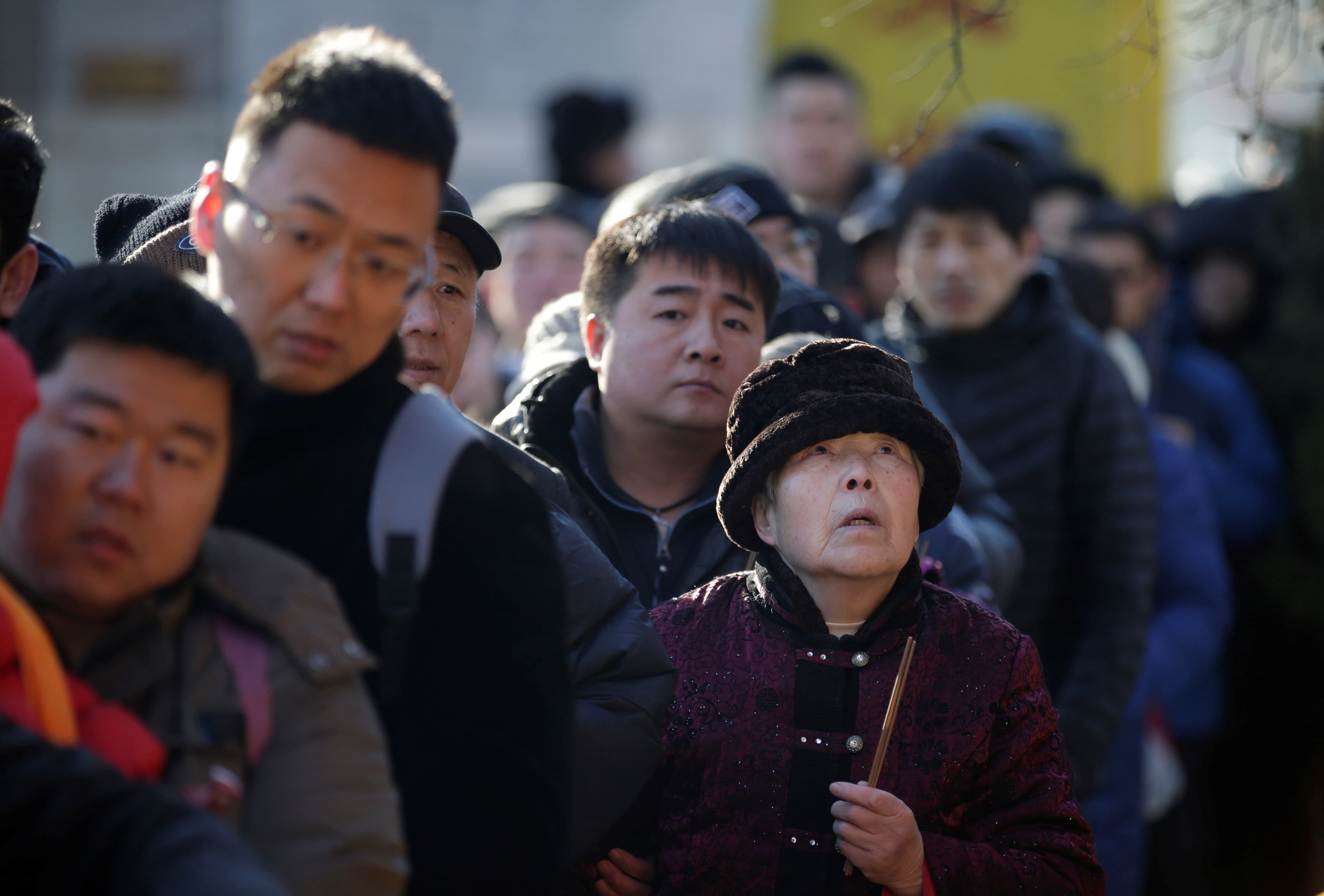 Chinese gather near Baiyun Temple in Beijing to pray for good fortune on the fifth day of the Lunar New Year