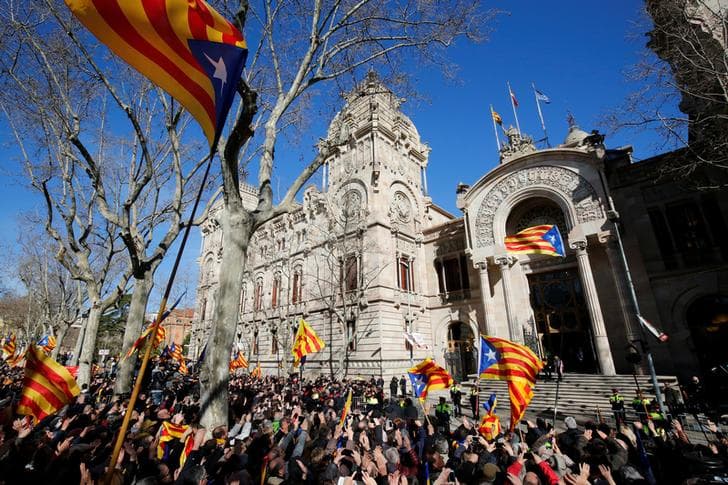 ​Former Catalan President Artur Mas and former regional councilors Irene Rigau and Joana Ortega leave court after attending the first day of their trial for staging a 2014 informal referendum on independence in breach of a legal order, in Barcelona, Spain