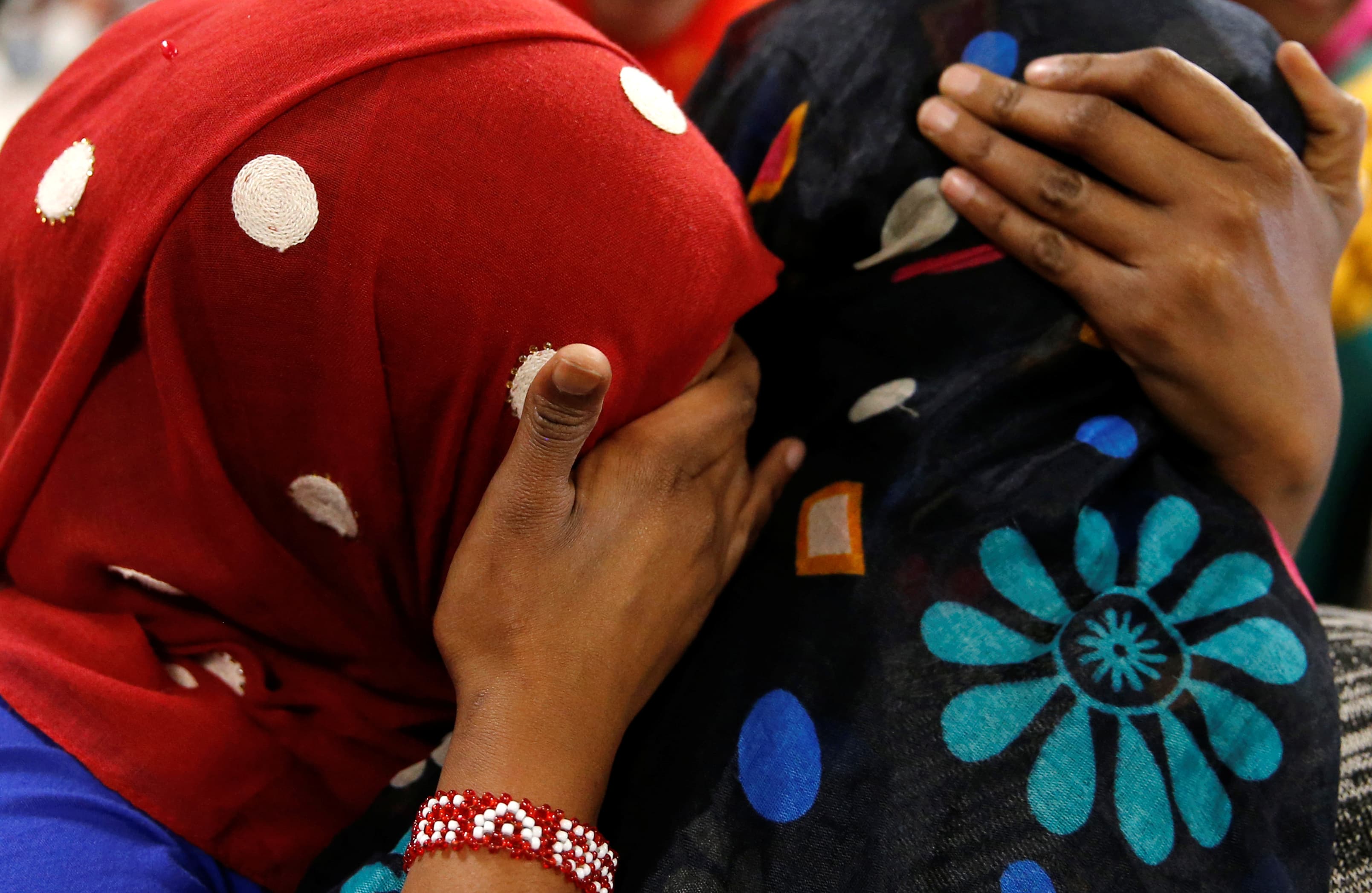 Asma Abdinasir (L), a Somali national who was initially denied entry to the U.S. because of the recent travel ban, is greeted by her mother Zahra Warsma (R) at Washington Dulles International Airport in Chantilly, Virginia, U.S. February 6, 2017.