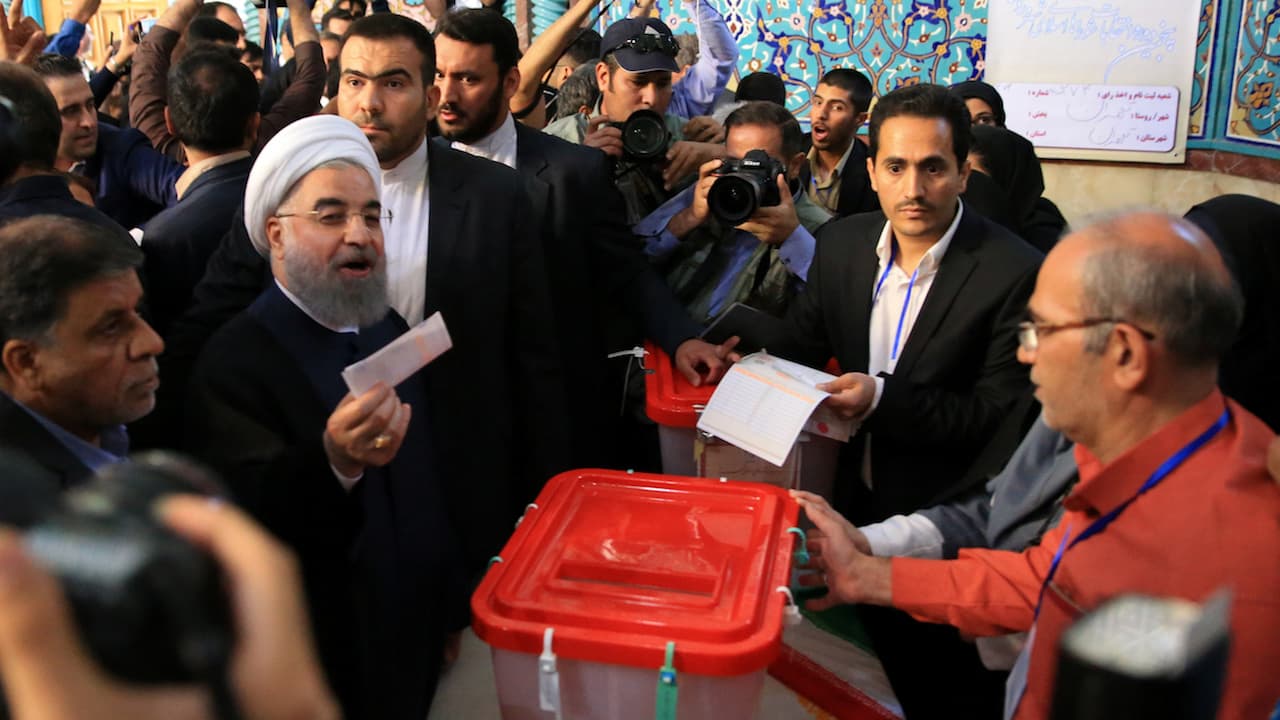Iranian President Hassan Rouhani casts his vote during the presidential election in Tehran, Iran, May 19, 2017.