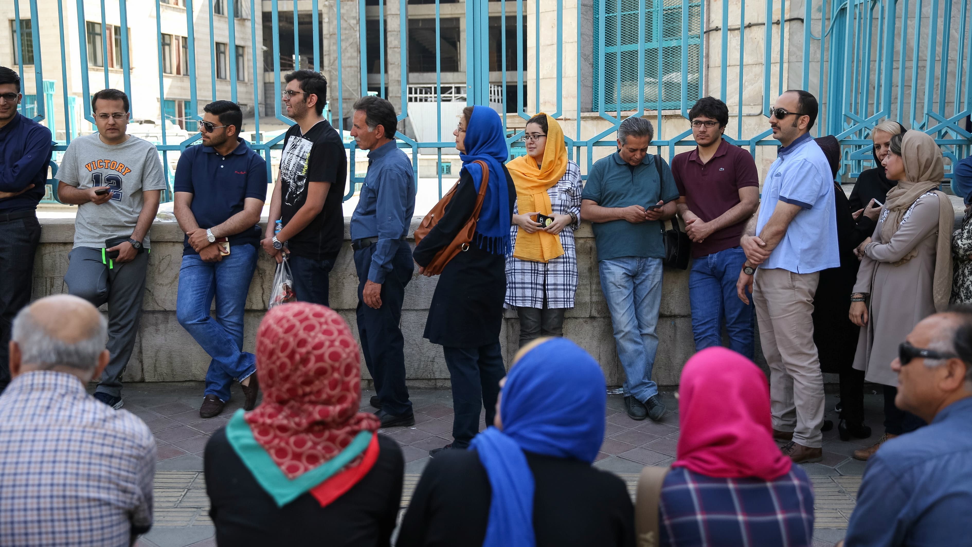 Iranians wait to cast their votes during the presidential election in Tehran, Iran, May 19, 2017.