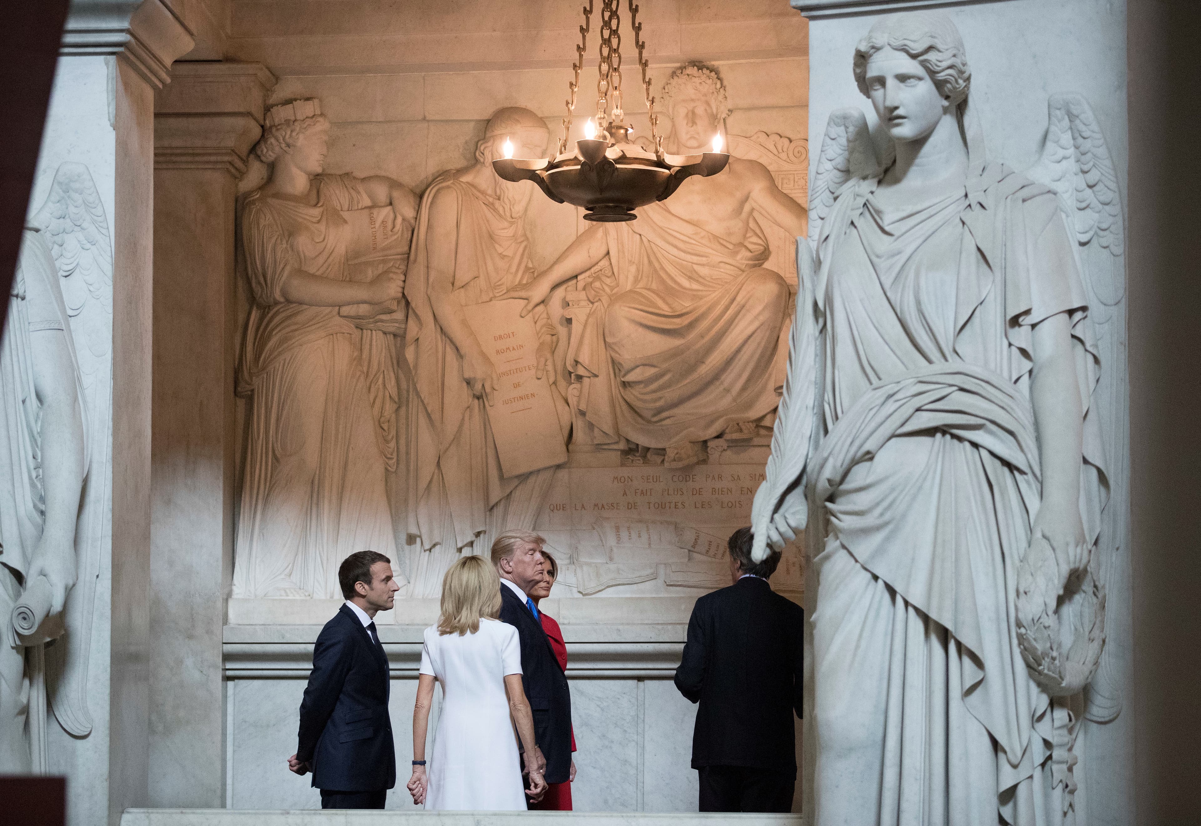 U.S. President Donald Trump and First Lady Melania Trump, French President Emmanuel Macron, and his wife Brigitte Macron tour Napoleon Bonaparte’s Tomb at Les Invalides in Paris, France, July 13, 2017.