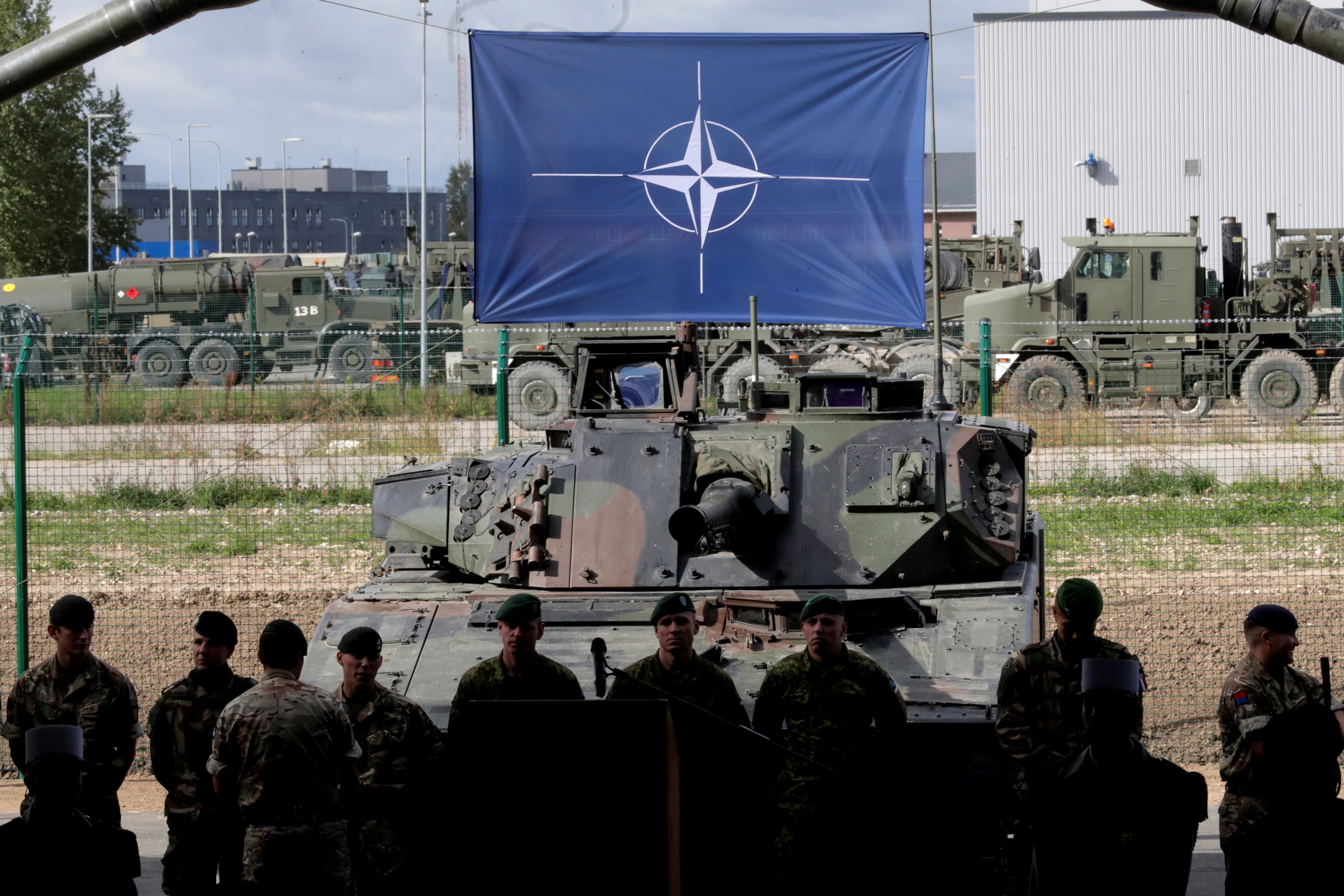NATO eFP battle group soldiers wait for NATO Secretary General Jens Stoltenberg visit the Tapa military base in Estonia.