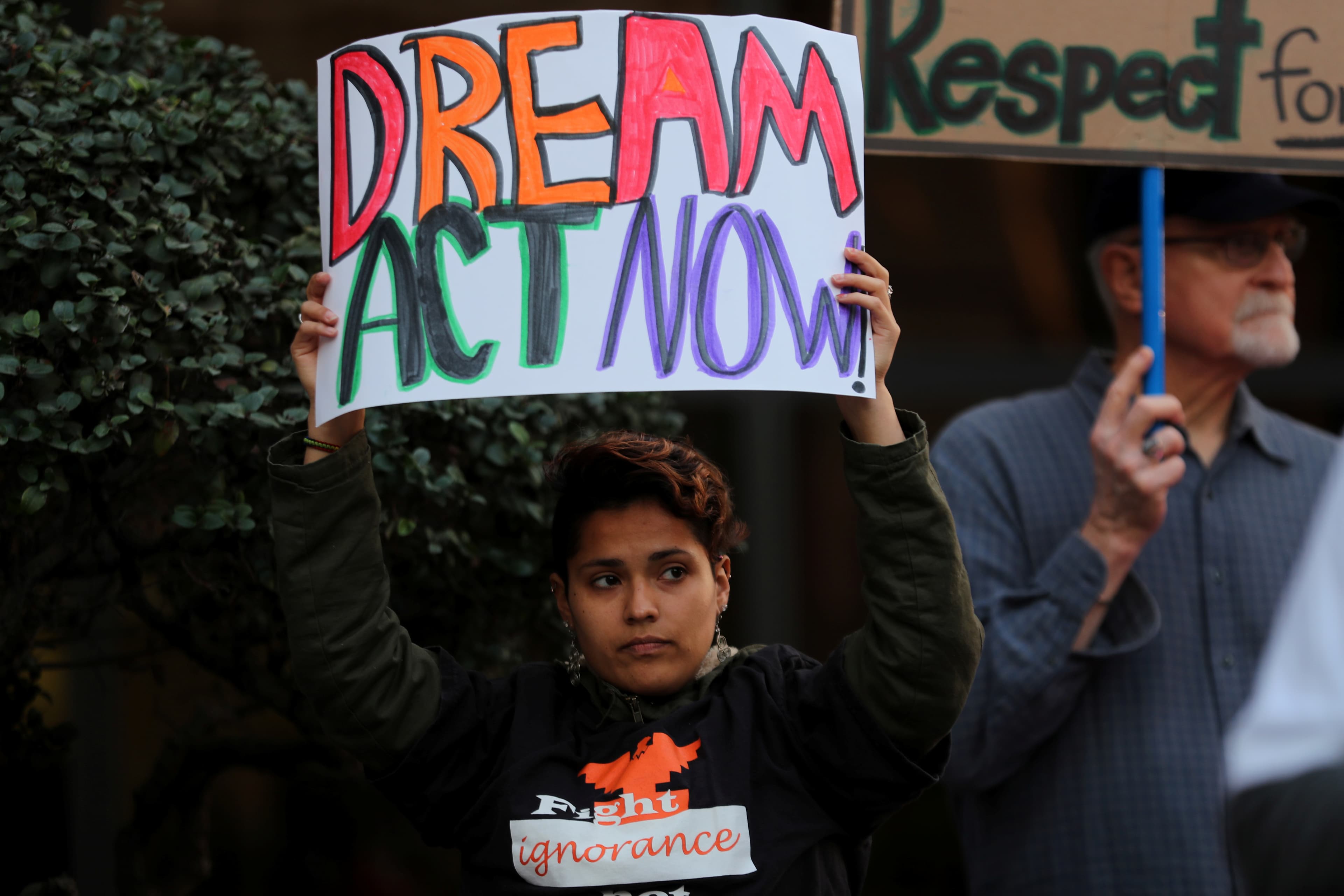 A women demanding action by the federal government on the Deferred Action for Childhood Arrivals (DACA) protests with a group in downtown San Diego.