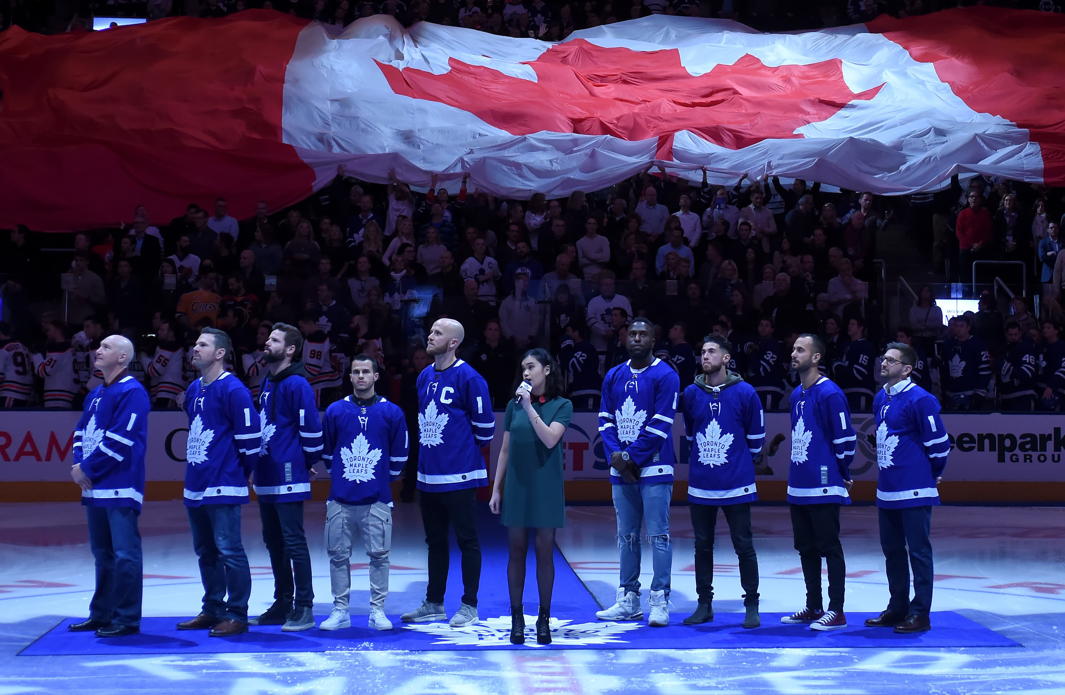 Members of Major League Soccer champs Toronto FC stand for the anthems after being honored in a pre-game ceremony.