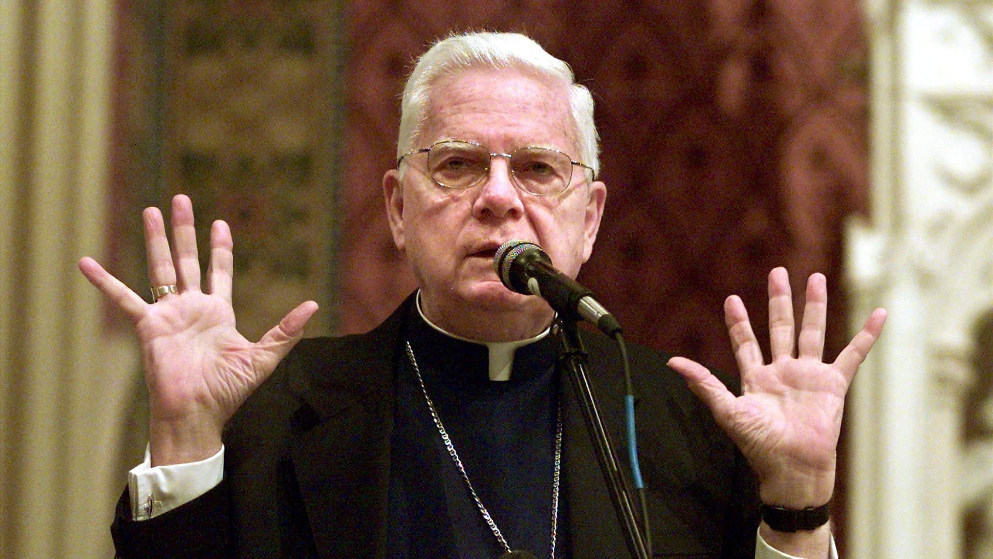 Boston's Roman Catholic Cardinal Bernard Law leads a prayer service for Boston area Catholic youth in Newton, Massachusetts, before joining them on a nine-hour bus ride to Toronto to see Pope John Paul II and attend World Youth Day July 23, 2002.