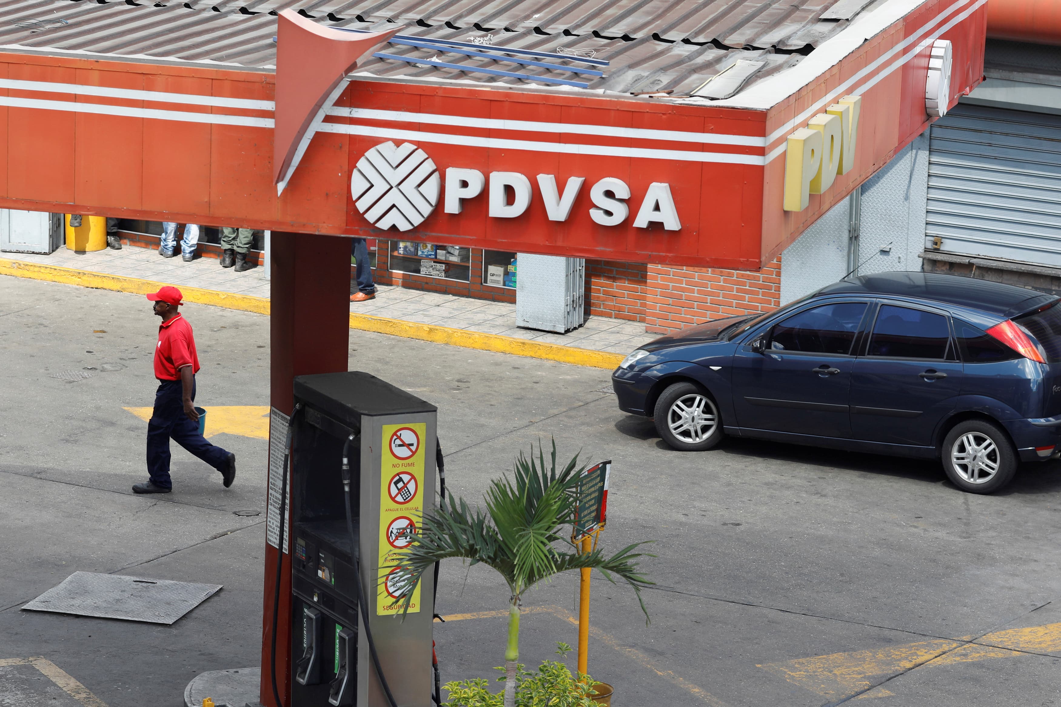 The corporate logo of the state oil company PDVSA is seen at a gas station in Caracas,