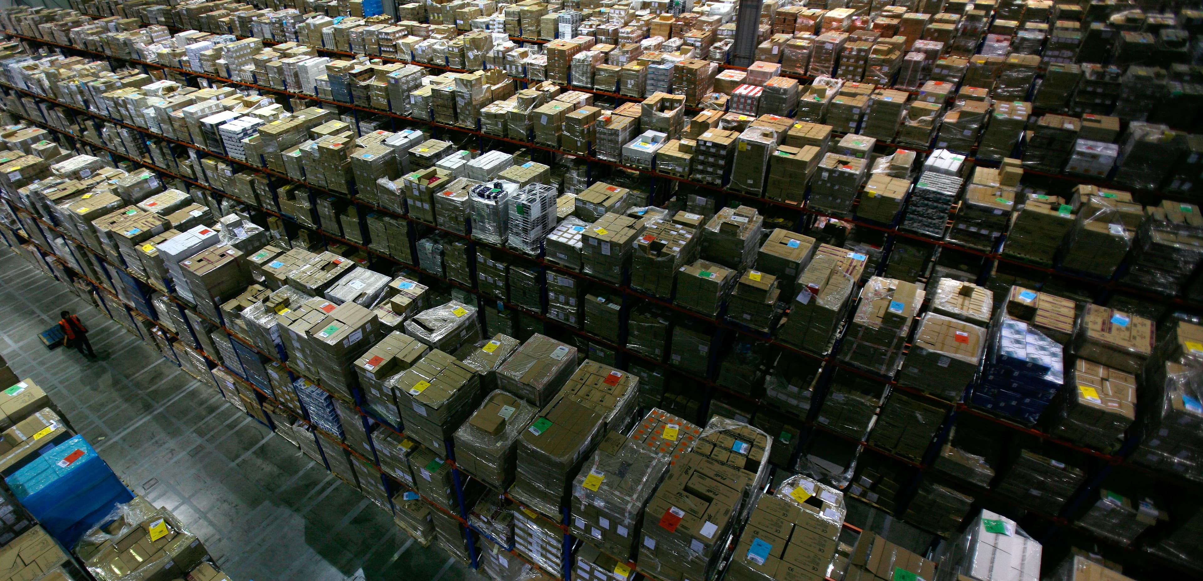 An Amazon warehouse in the UK. 'Pickers' are allowed a set number of seconds to locate and pick up individual orders.