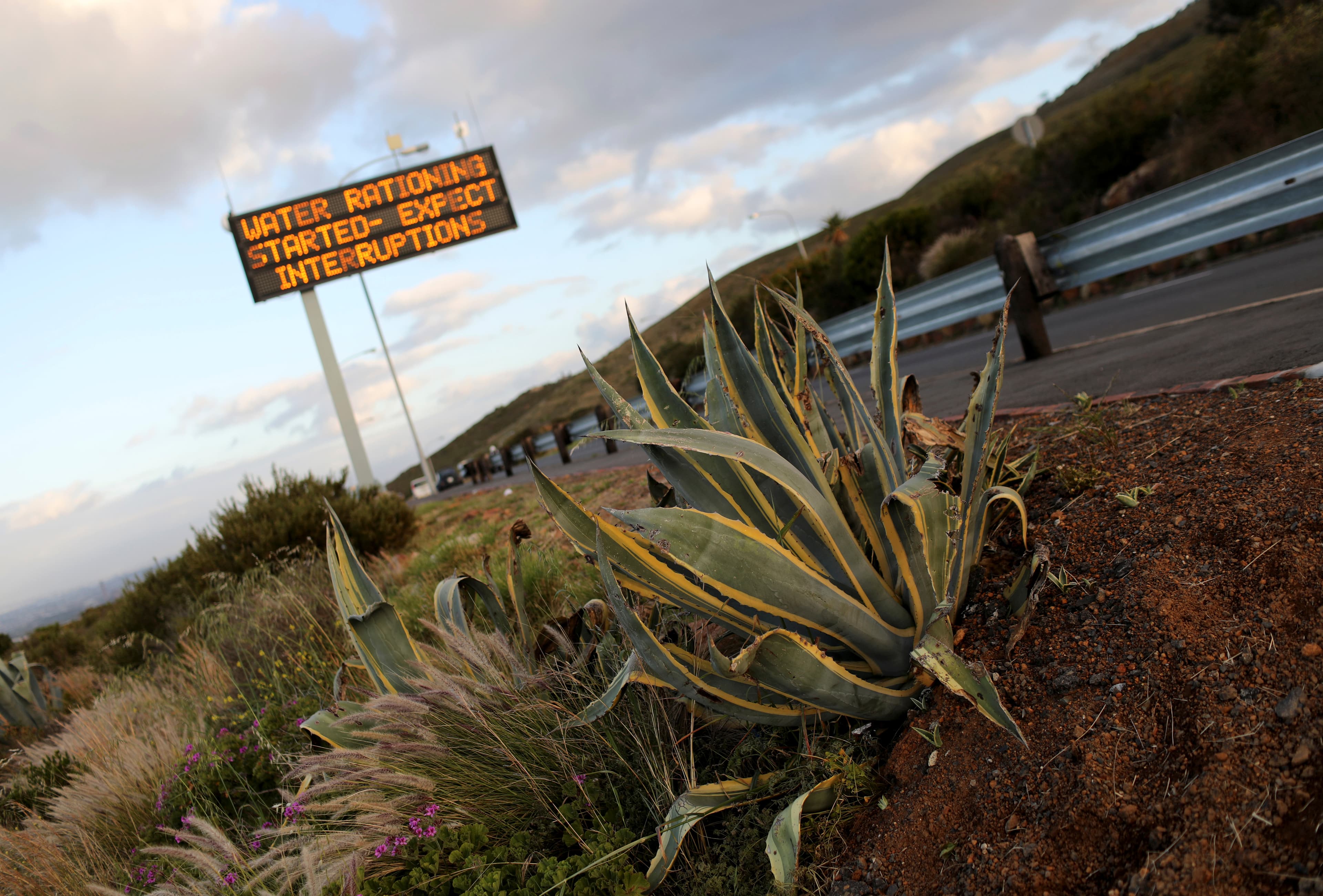 Sign warning residents of water restrictions is seen in Cape Town.