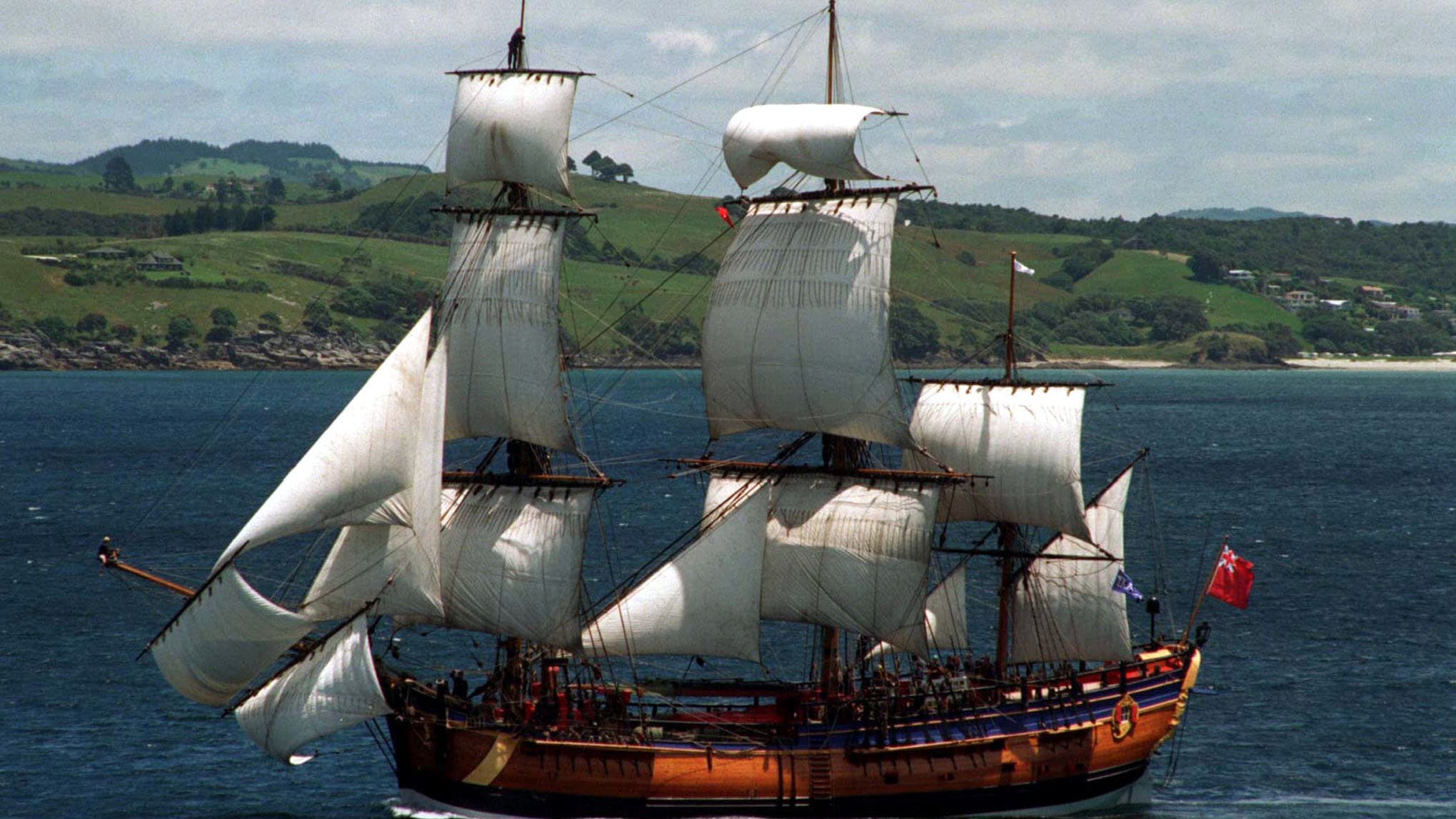 A replica of Captain Cook’s ship, the Endeavour, sailing off the coast of New Zealand in 1995. The replica was built in Australia in 1994, where Cook is a national hero.