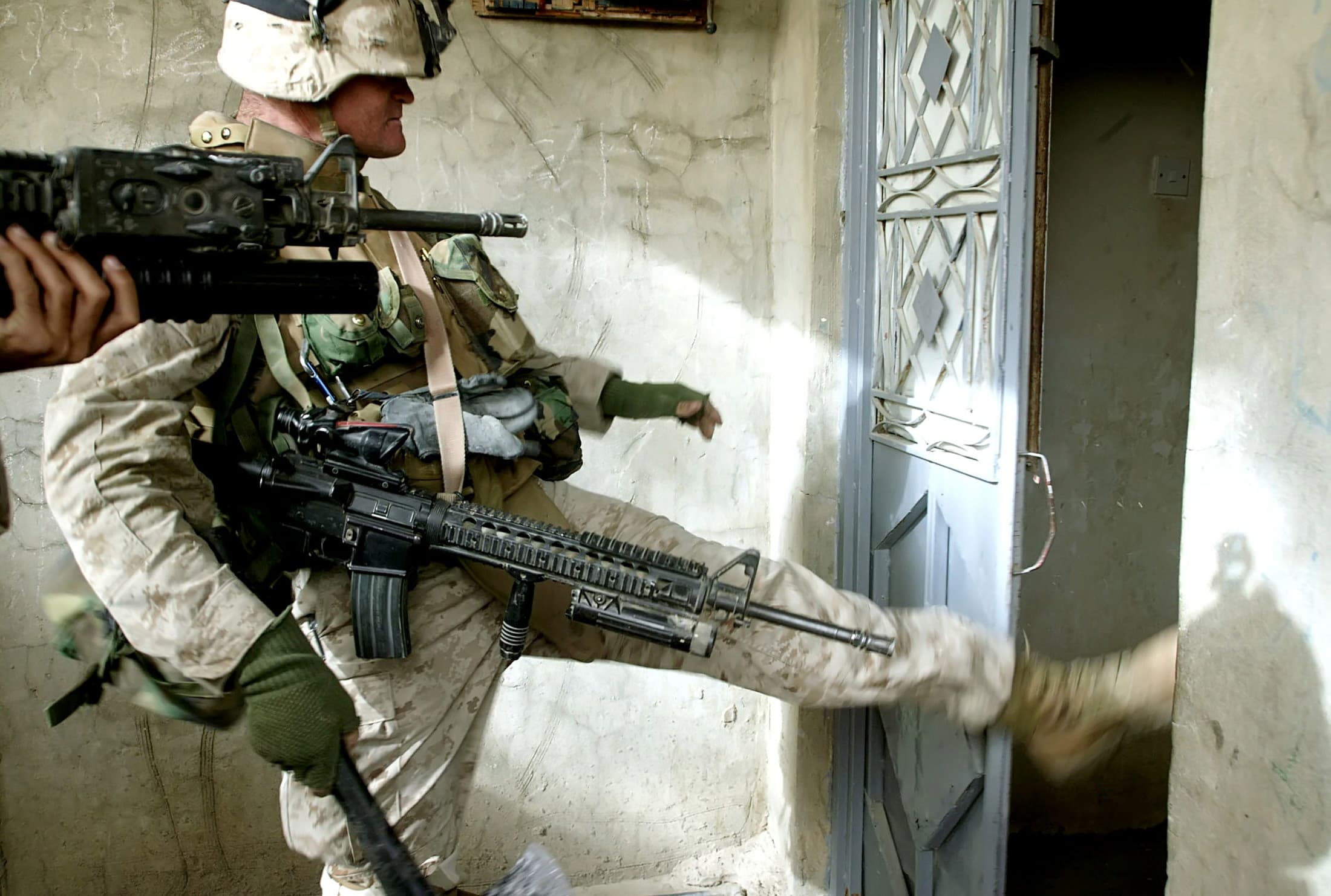 U.S. Marine Lance Corporal Michael Oliver Ray, on a search operation in Fallujah, Iraq in December 2004. An American offensive at the time came to be known as "The Second Battle of Fallujah."