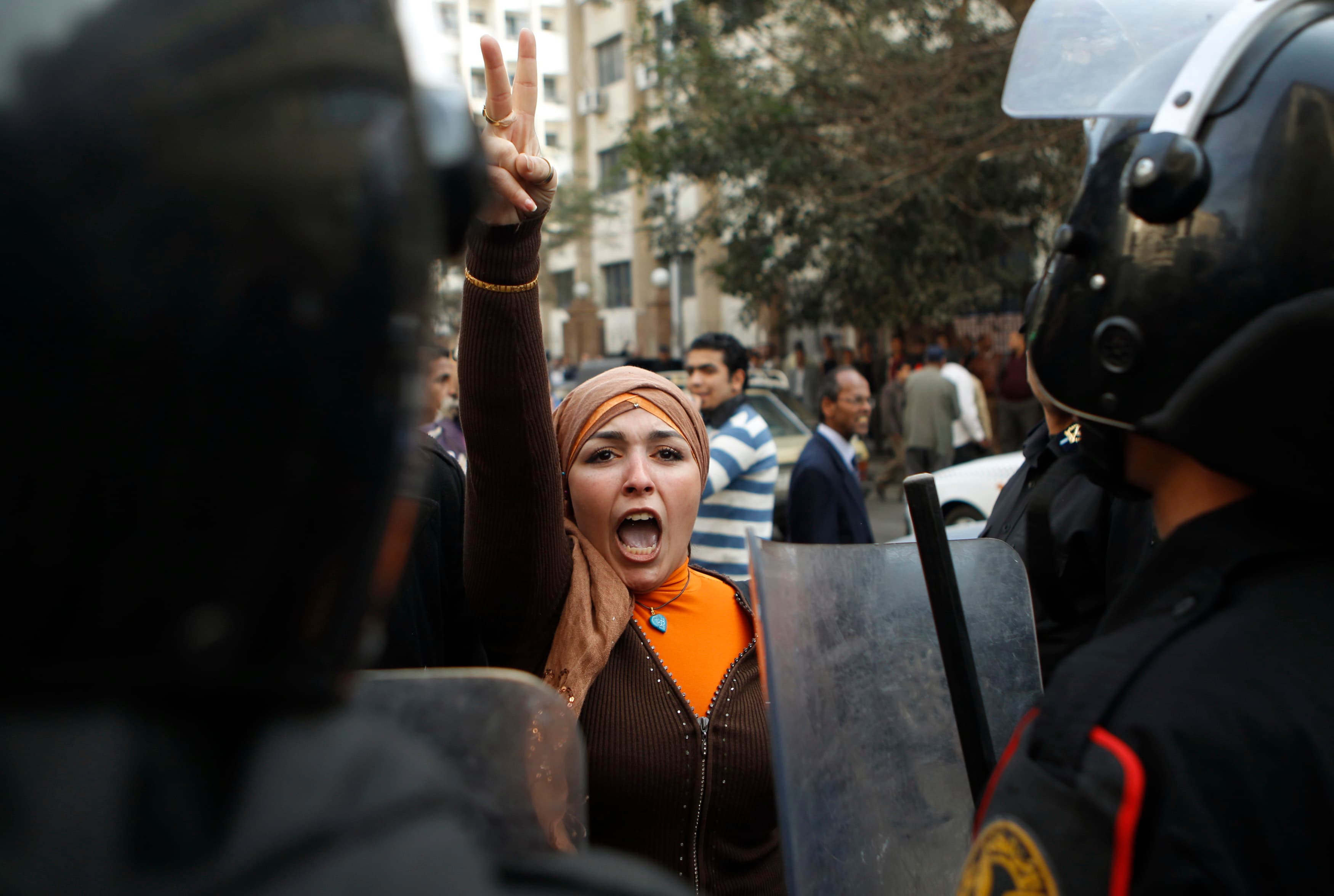 An anti-government protester gestures during clashes with police in Cairo January 26, 2011.