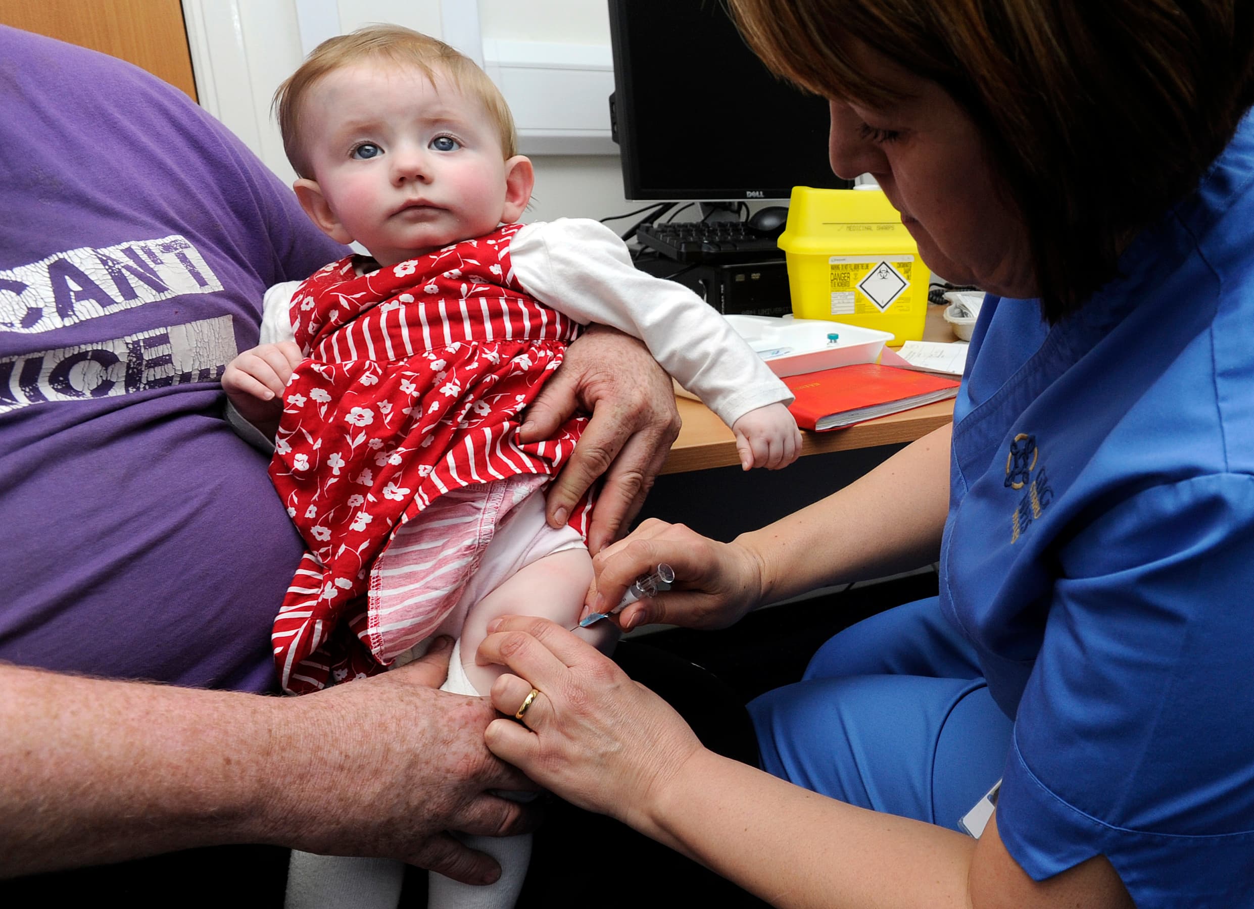 Ten-month old Lauren Durbin receives an injection for measles, mumps and rubella. Typically children do not receive the MMR vaccine until they are 12 months old.