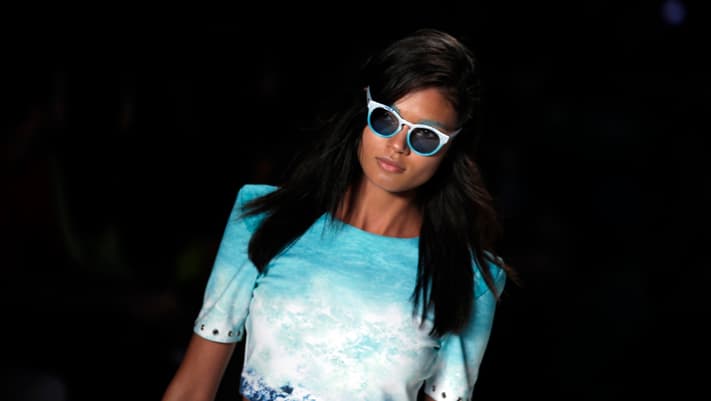 A model presents a creation from the Cola Cola 2013/2014 summer collection during Rio Fashion Week in Rio de Janeiro April 18, 2013.