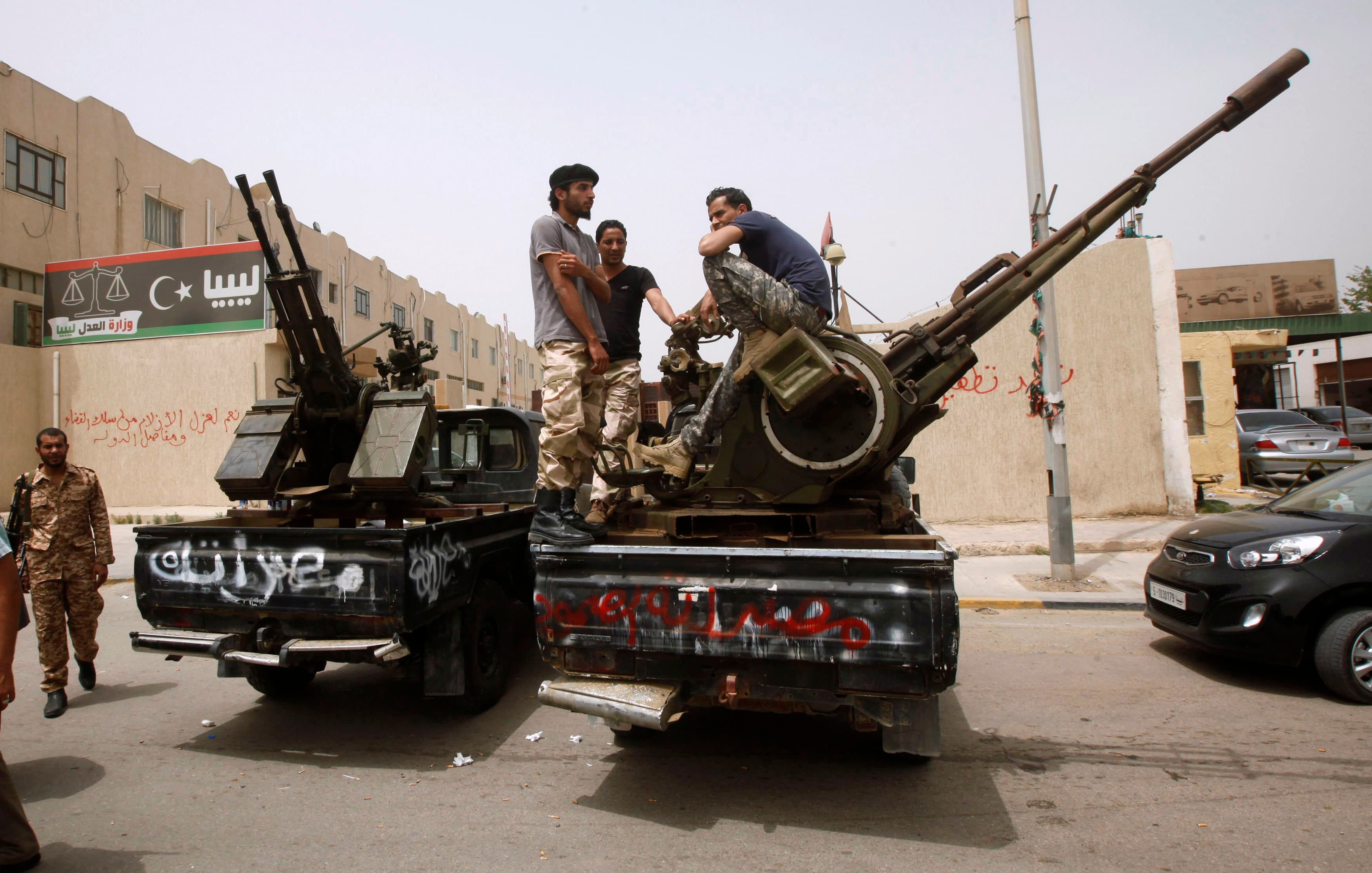 Members of armed revolutionaries stage a protest in front of the Libyan Justice Ministry in Tripoli on April 30, 2013.