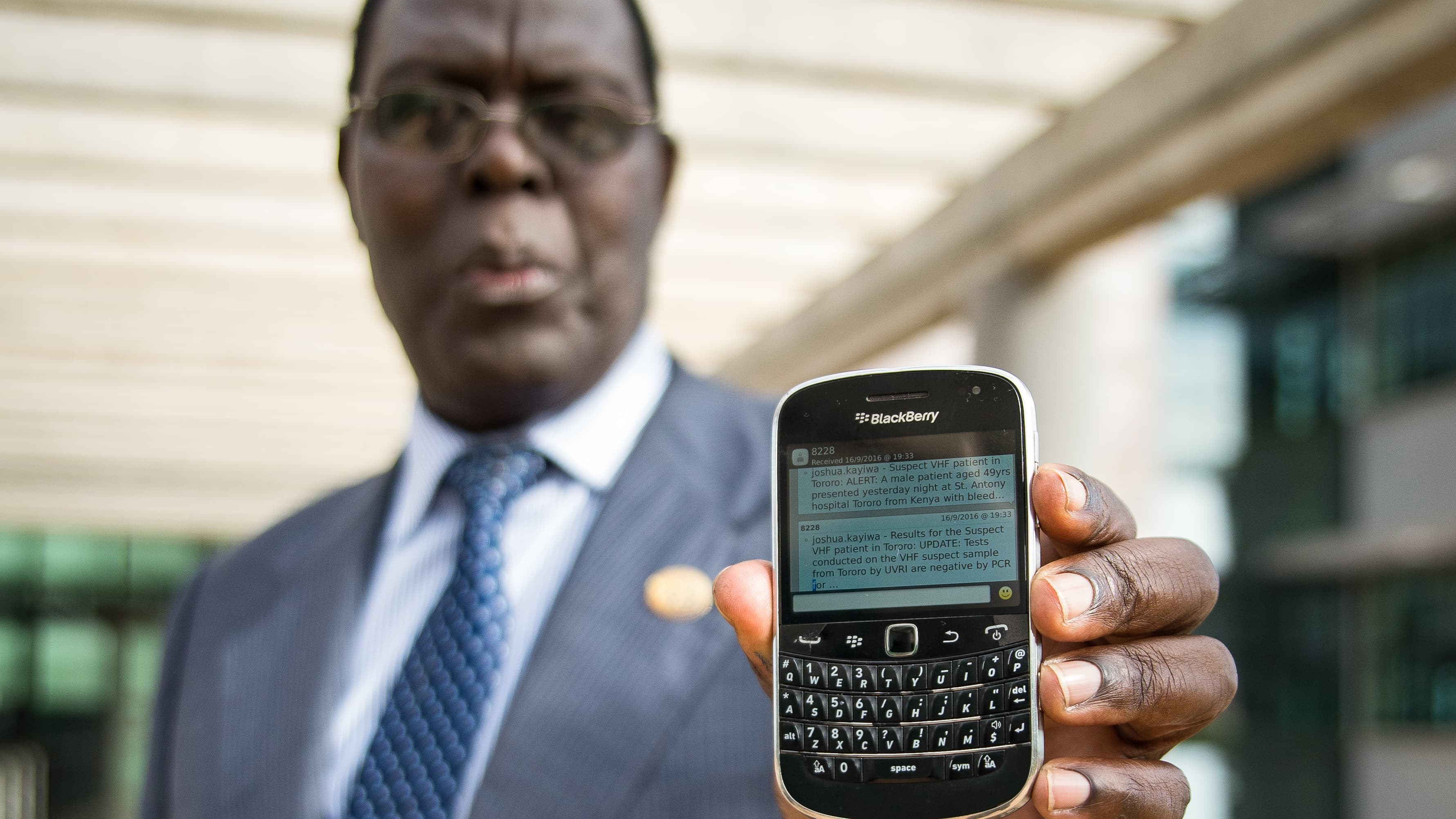 Aisu shows off an Ebola text message he recently received.