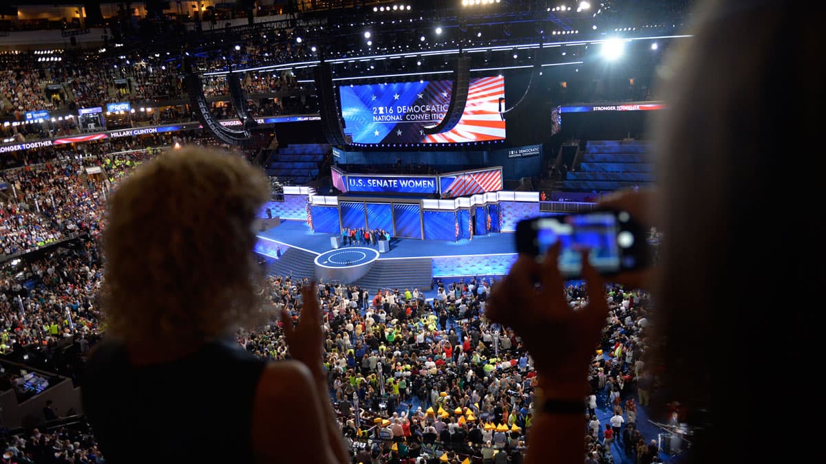 Delegates watch the Democratic Women of the Senate address at the DNC in Philadelphia.