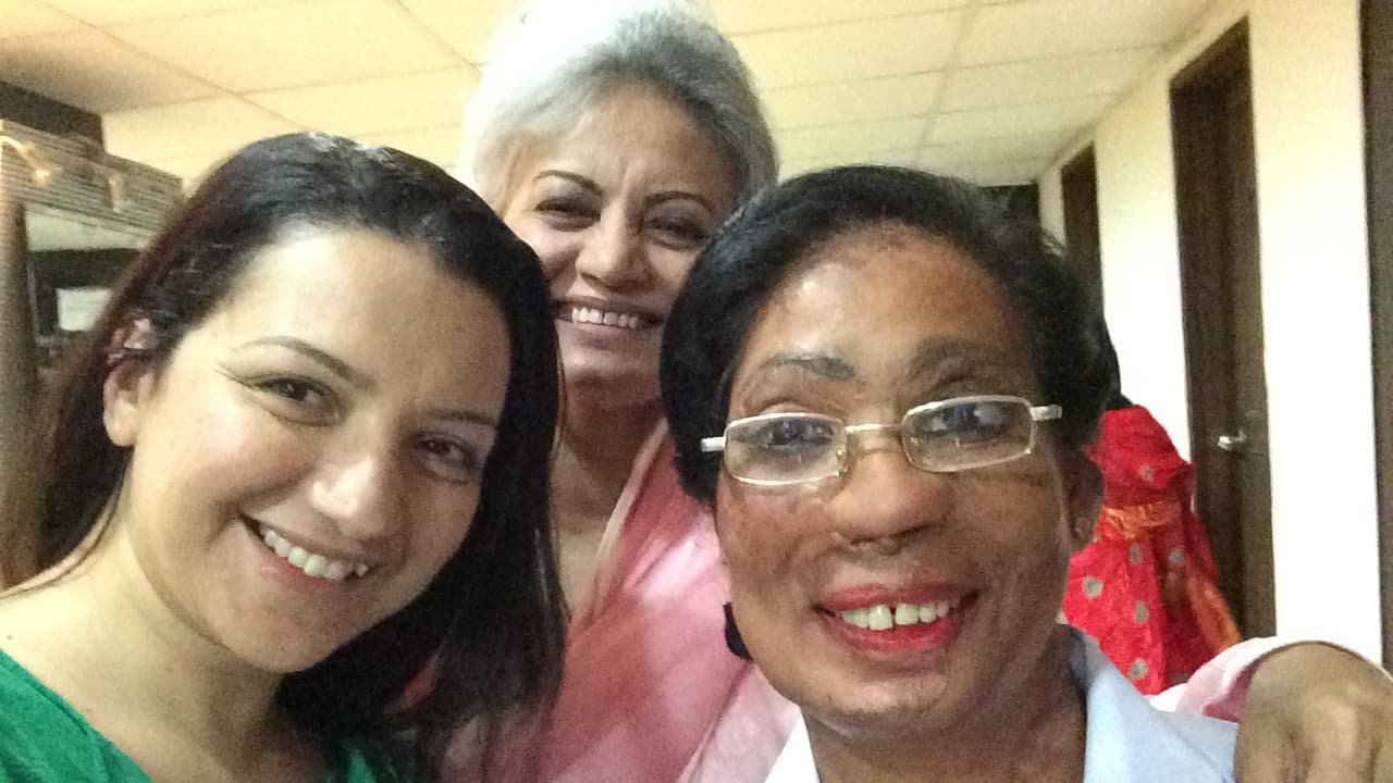From left, BBC reporter Shaimaa Khalil, salon owner Murtasa Misbah and acid attack victim Bushra Shafi, who got medical attention for her burns thanks to Misbah and now works at her salon.