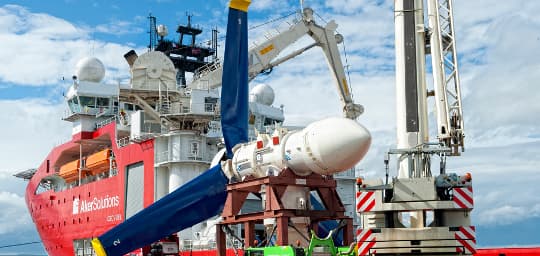 Ship with underwater turbine