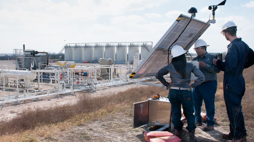 Andrea Carolina and Desikan Sundararajan with Statoil, along with Dirk Richter, founder of Quanta3 (left to right), install a pilot methane detector at a Statoil well pad at the Eagle Ford Shale natural gas site in Texas.