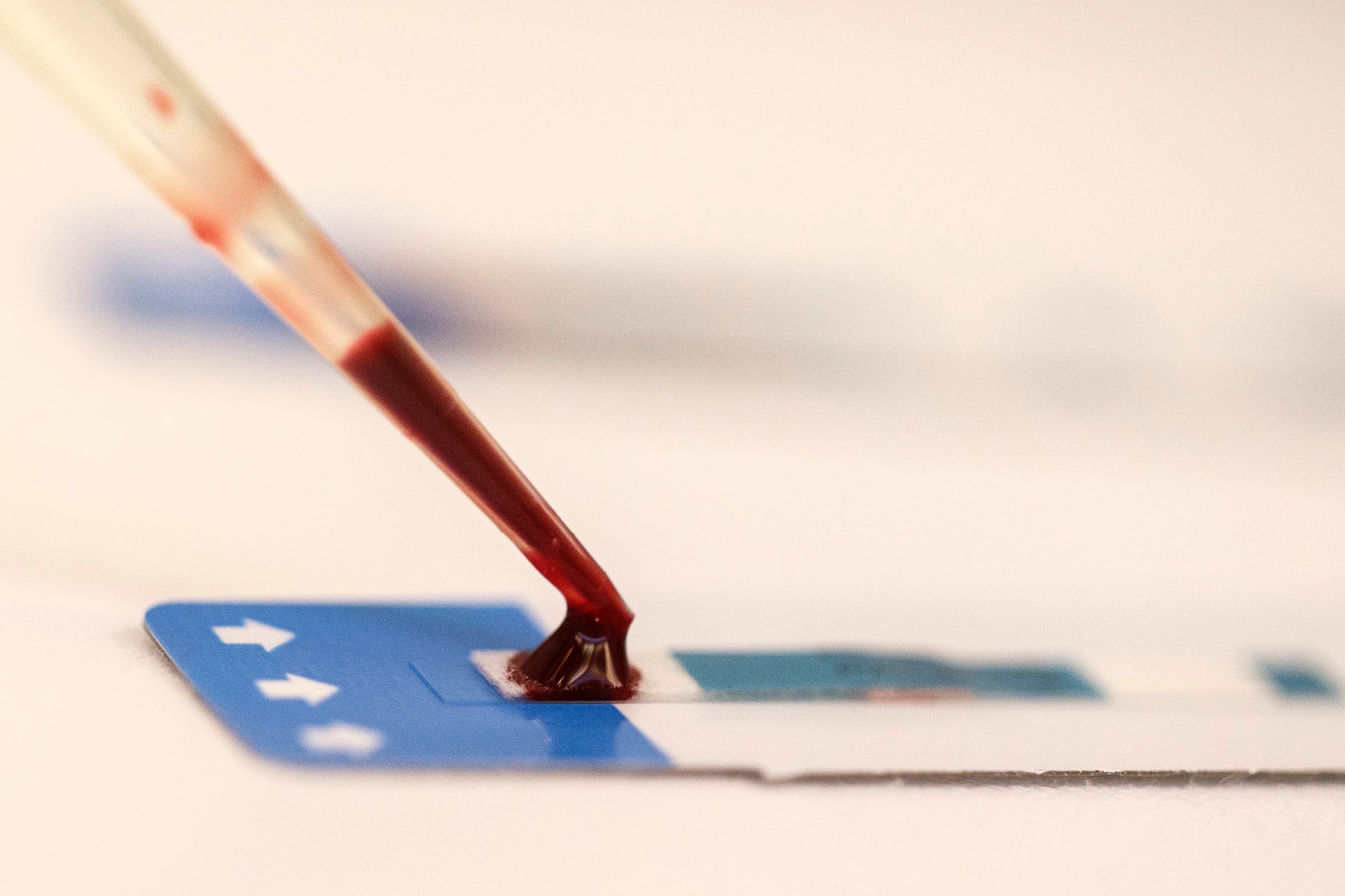 A nurse tests a blood sample during a free HIV test at a blood tests party, part of a campaign to prevent HIV infection among male same-sex couples, in Bangkok September 20, 2014.
