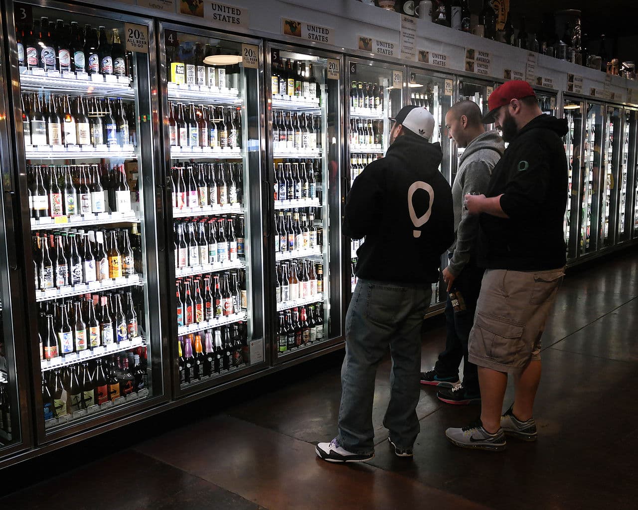 Beer buyers contemplate their choices at The Beer Stein in Eugene, Oregon. Many of those choices are brewed by Oregon's 171 craft breweries.