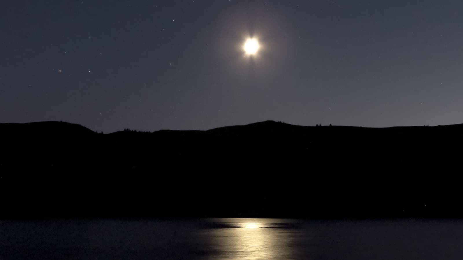 The Tiangong-1 space station passes over the moon in this photo taken in September 2013. The station is scheduled to make a crash landing in Europe within the next few weeks.