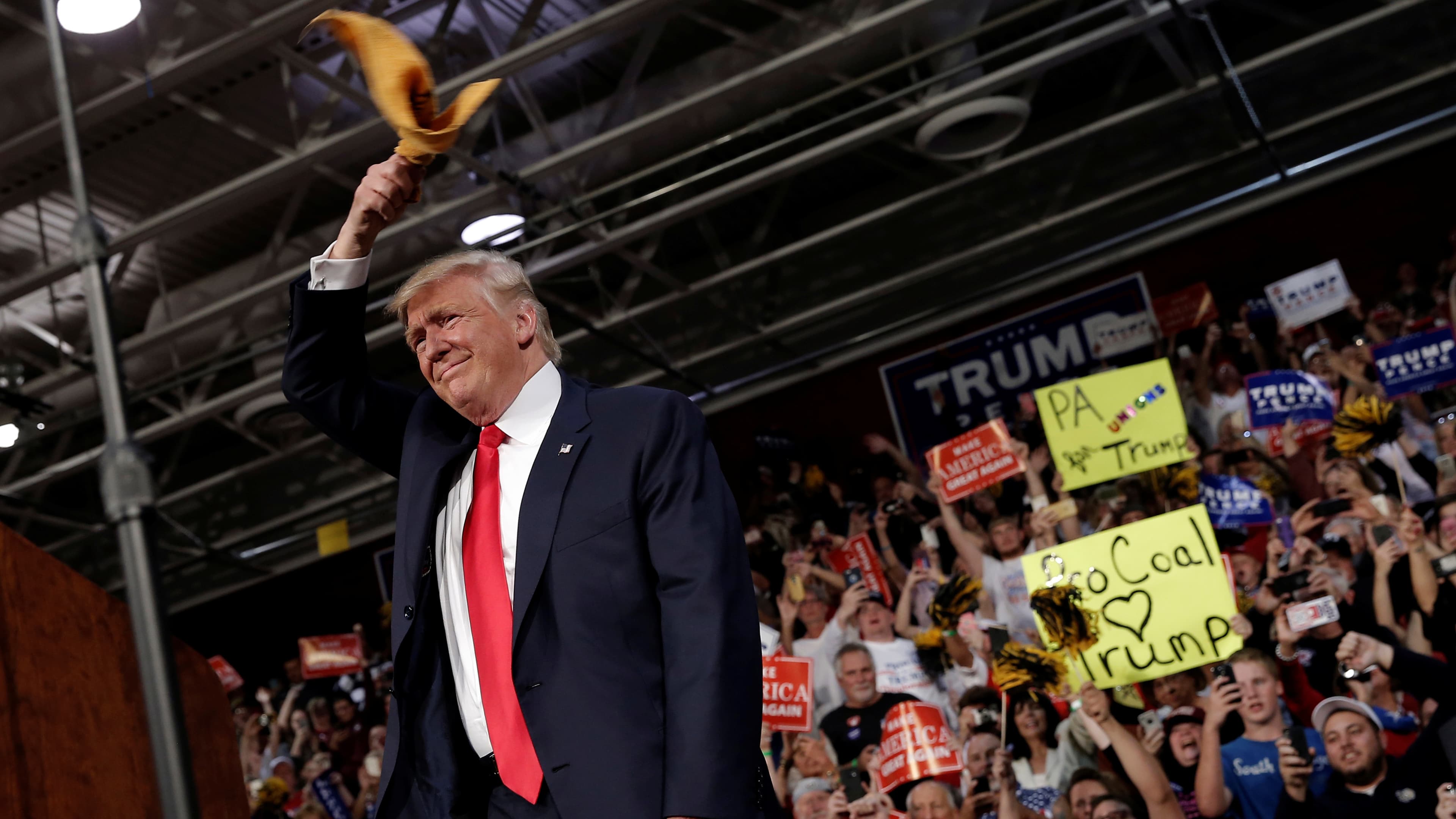 Republican U.S. presidential nominee Donald Trump arrives at a campaign rally in Ambridge, Pennsylvania, October 10, 2016. He waves "The Terrible Towel," the rally towel of the Pittsburgh Steelers.