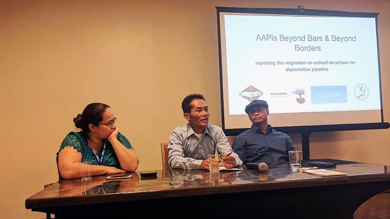 A man in a speaker panel is talking.