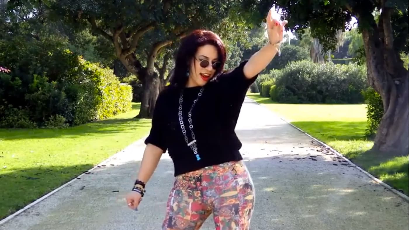 A Tunisian woman dances to "Happy".