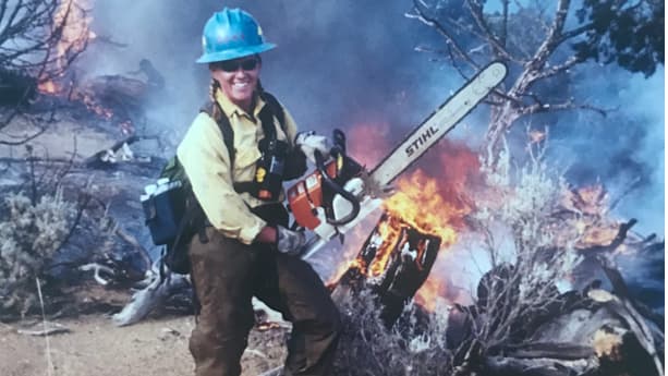 Abby Bolt with chainsaw