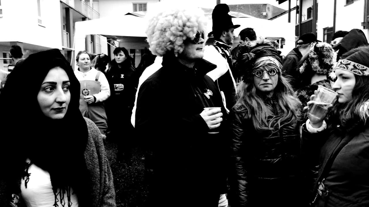 Wesam Daas, left, with Carnival revelers in Altenmarkt, Bavaria.