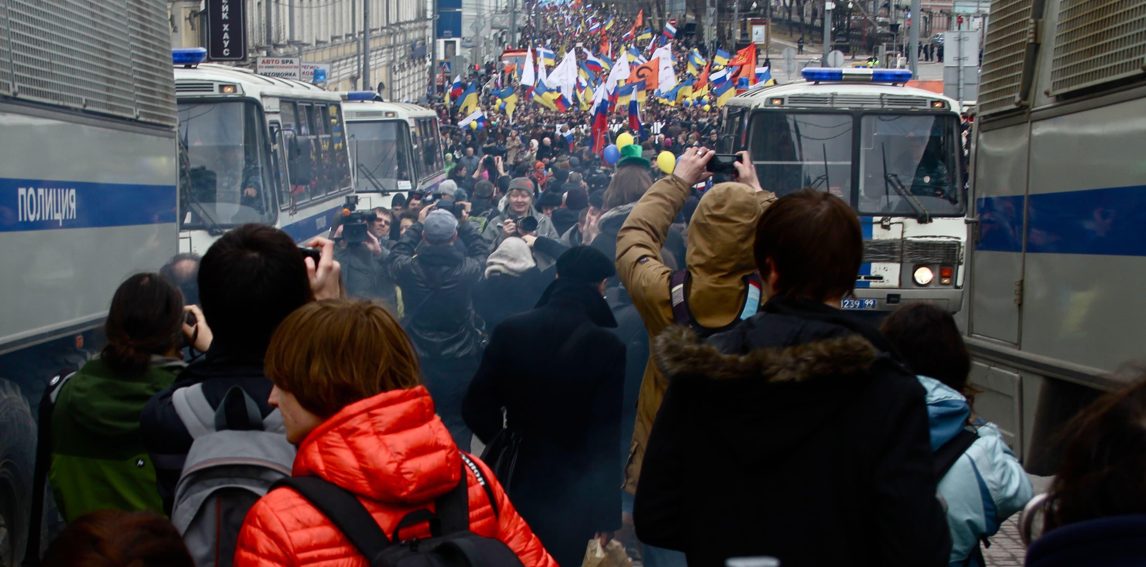 Police vans in line for a March for Peace in Moscow.