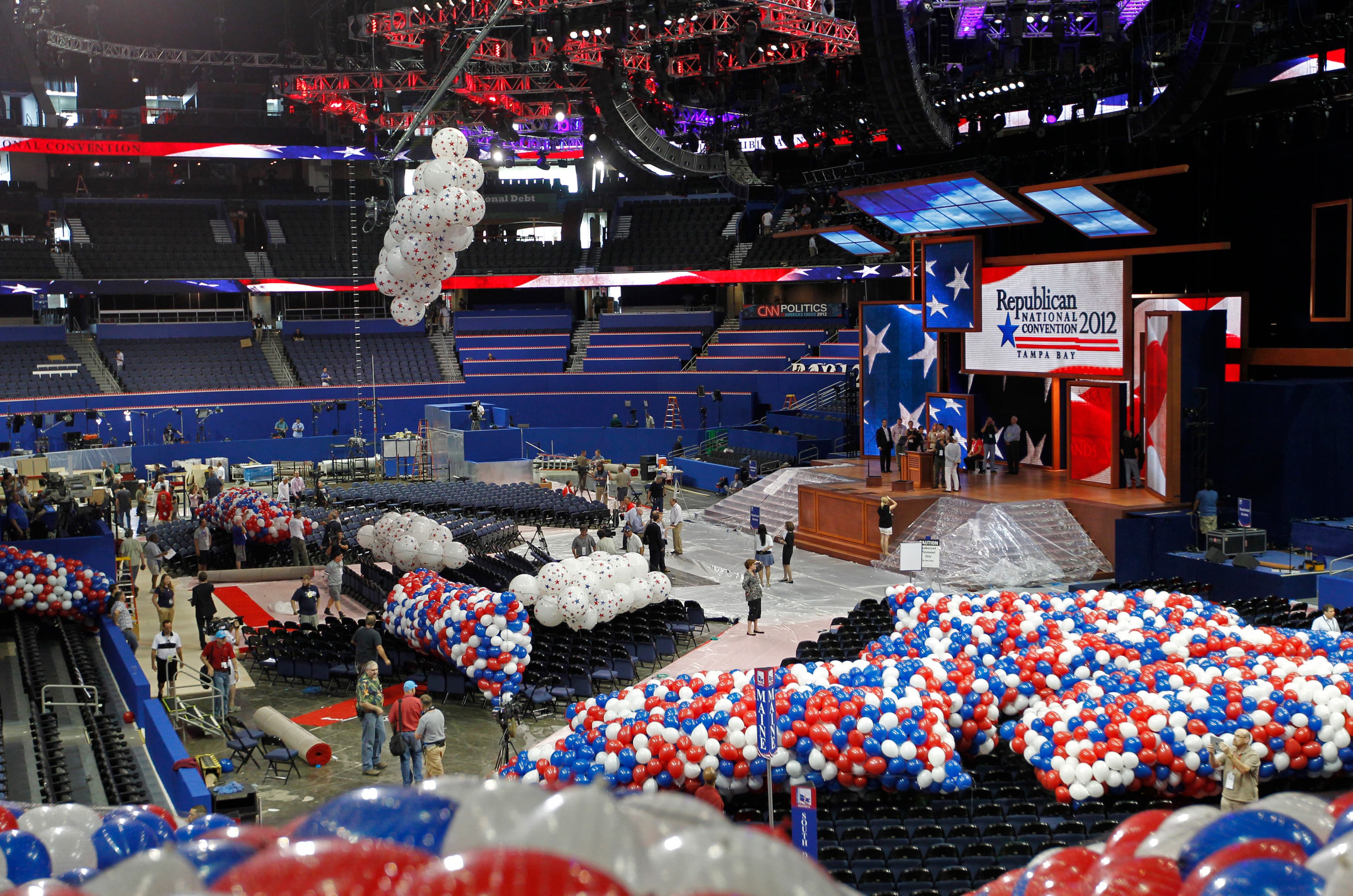 Technicians raise balloons