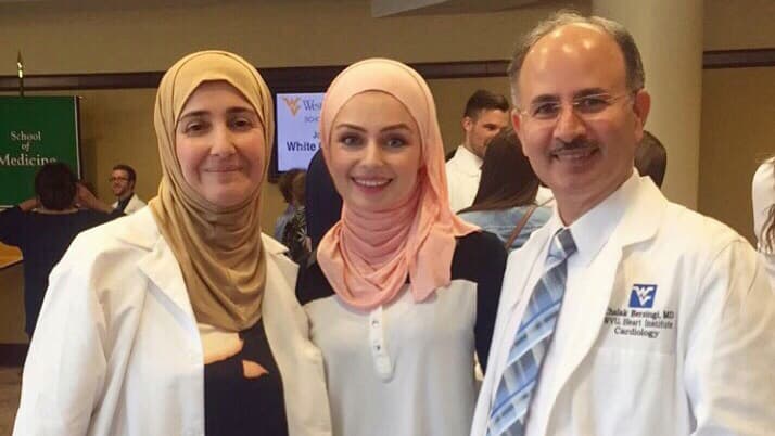 Dr. Chalak Berzingi poses with his wife, Dr. Mayada Issa, and his daughter, Seher Berzingi.