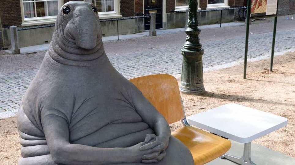 Dutch artist Margriet van Breevoort  created the gray tubby creature, "Homunculus Loxodontusa"  nicknamed “the one who waits.”