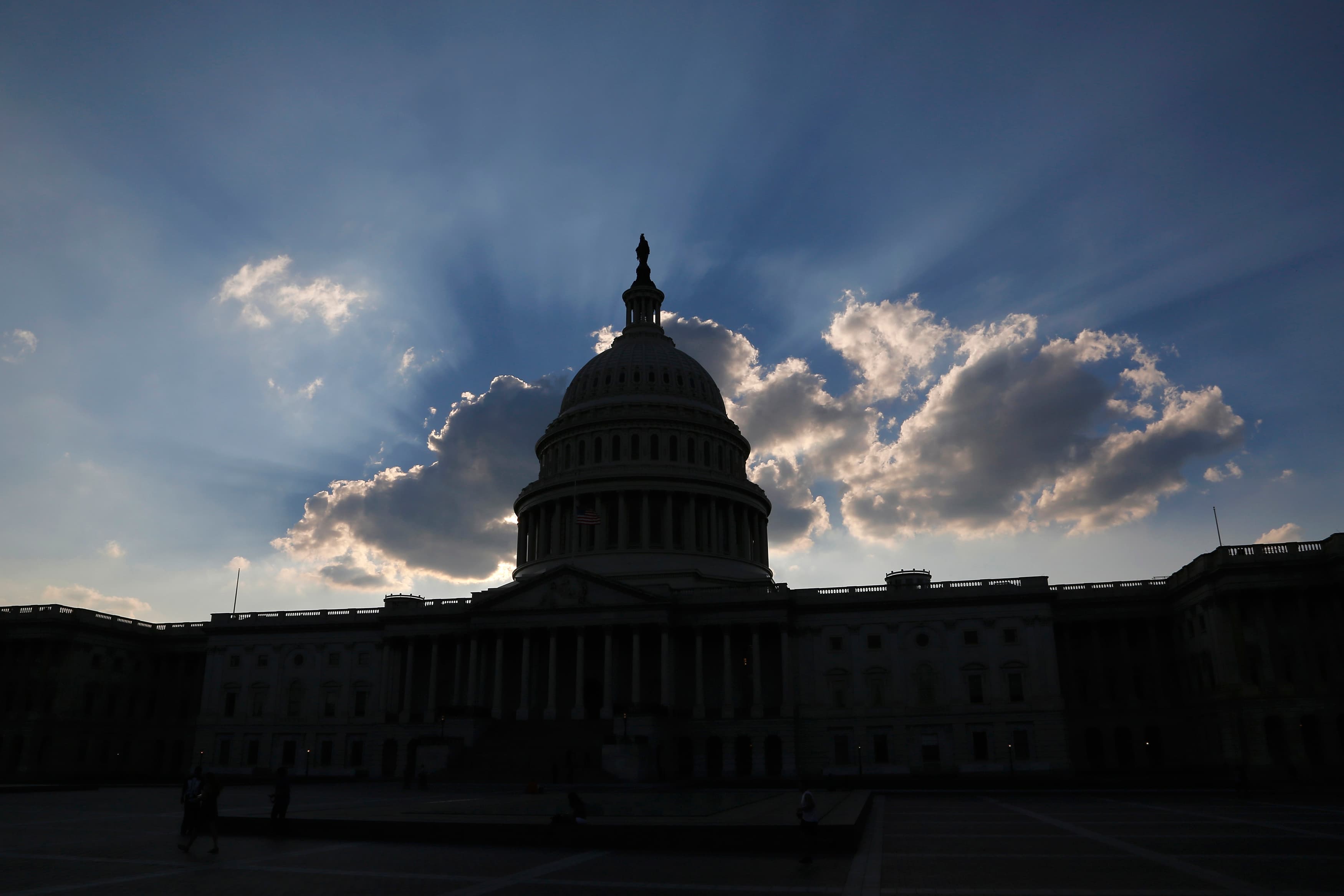 The sun sets behind the U.S. Capitol in Washington October 6, 2013.