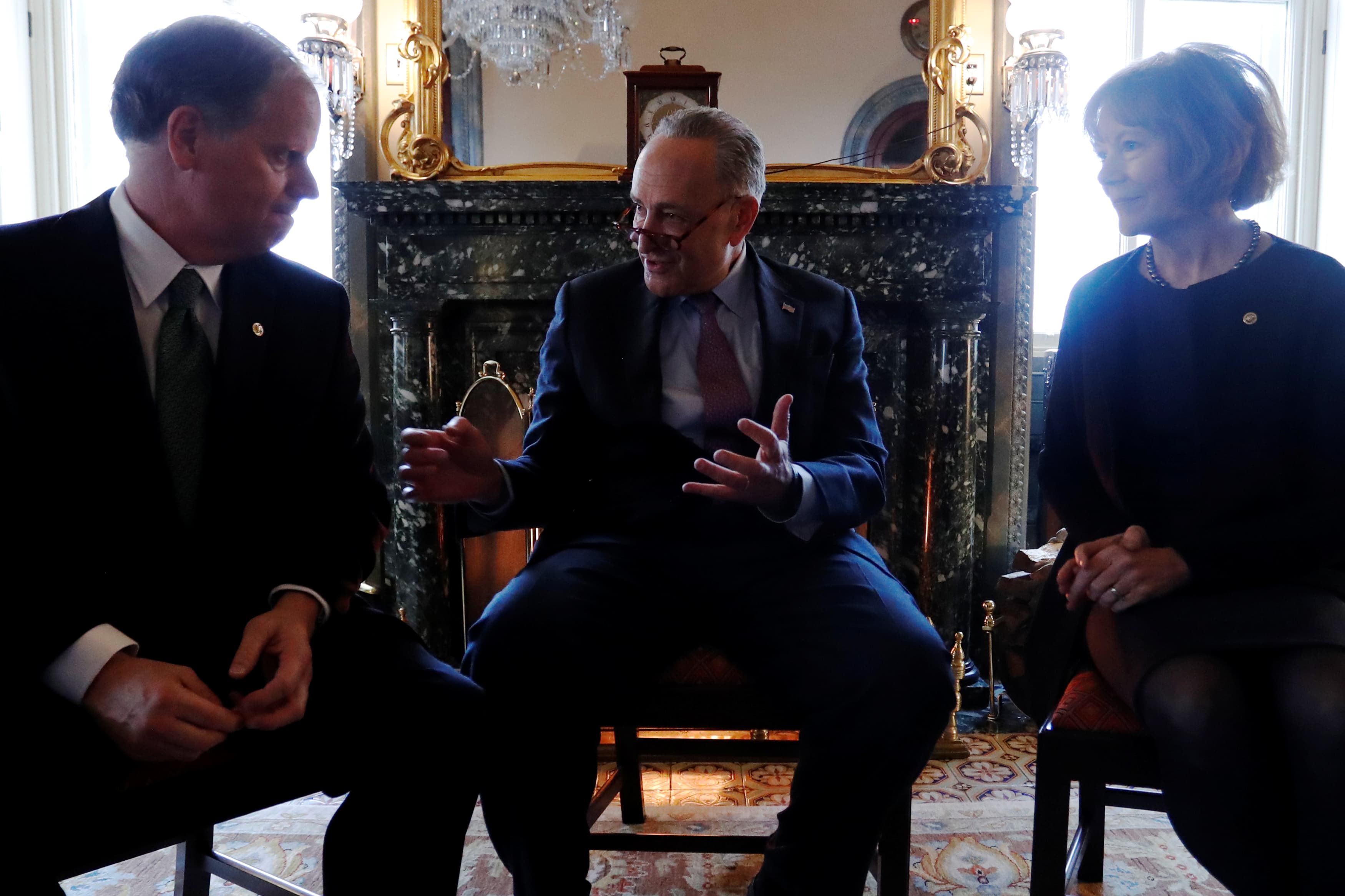 US Senate Minority Leader Chuck Schumer (D-NY) welcomes newly-sworn in Senator Doug Jones (D-AL) and Senator Tina Smith (D-MN)
