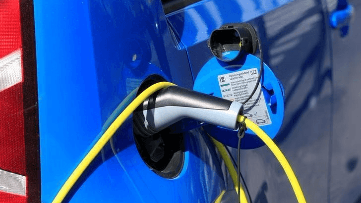 An electric car is charged at a parking lot in Oslo, Norway, June 1, 2017.