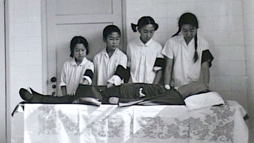 Bian Zhongyun's children mourn the death of their mother, as seen in the documentary "Though I am Gone." Bian was a school principal who beaten to death 1968 by a crowd.
