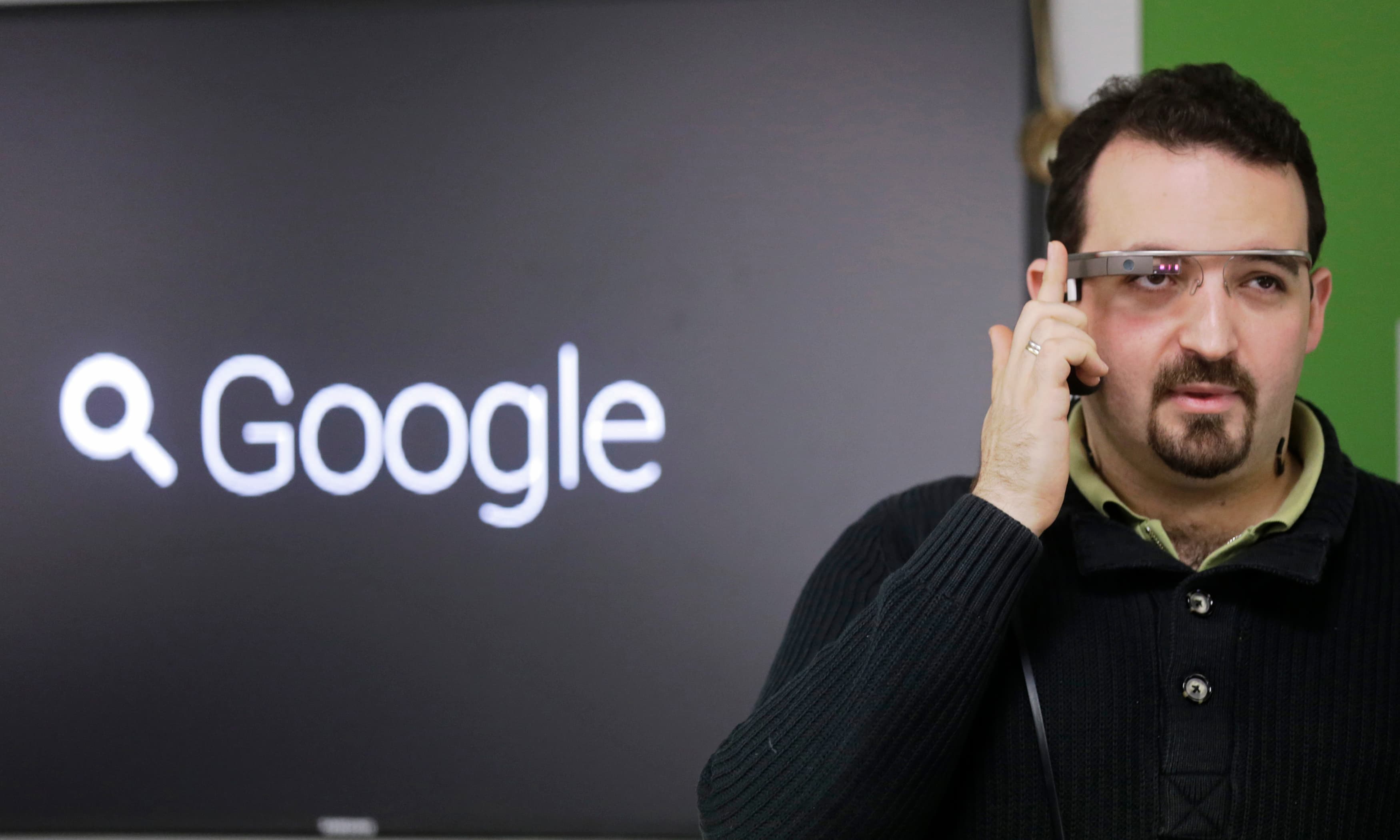 Developer Maximiliano Firtman wears a prototype Google Glass device in November 2013.