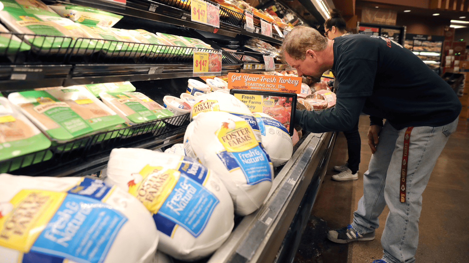 A customer shops for Thanksgiving ham at a grocery store in Los Angeles, California, Nov. 21, 2017.