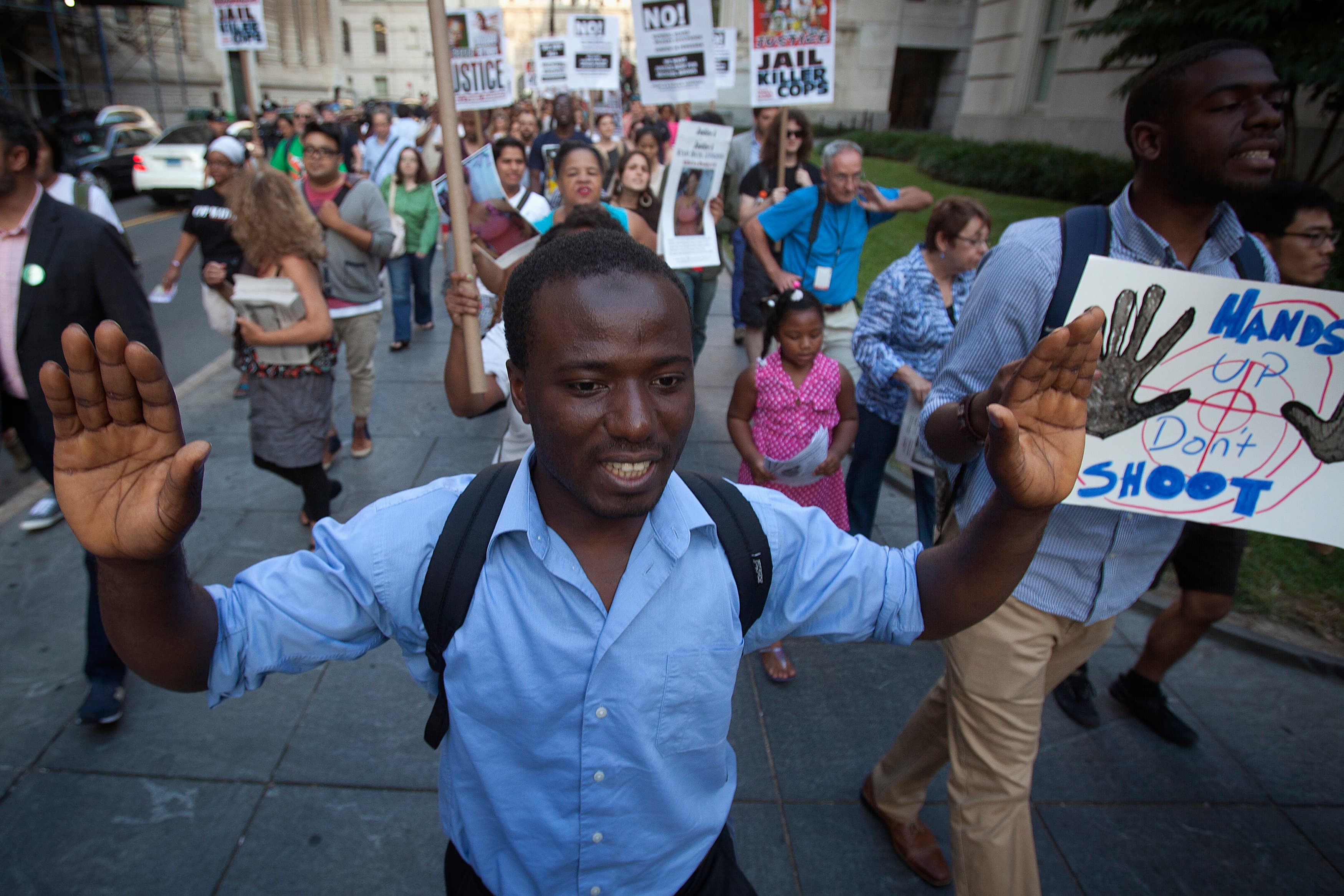 Hands up, don't shoot protesters